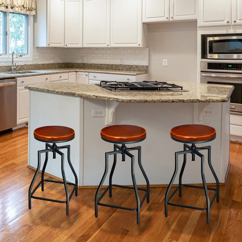 Wisbech Swivel Metal Adjustable Height Bar Stool | Wayfair North America