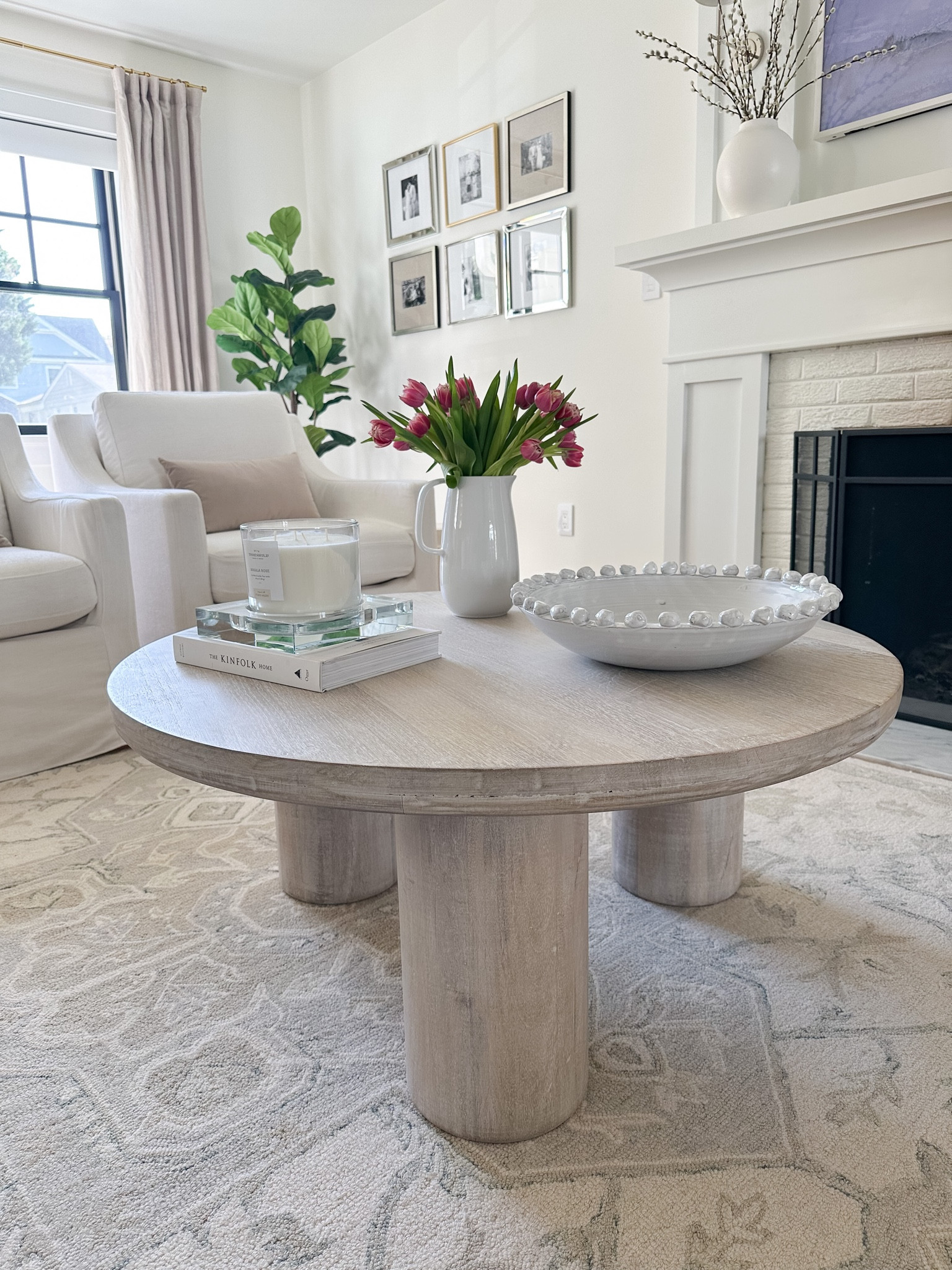 Shop my best sellers now on sale for Memorial Day! Pottery barn linen curtains, neutral area rug, washable Ruggable rug, round coffee table, hike decor, gold chandelier, gold table lamp, dining table, upholstered end of bed bench, upholstered bed