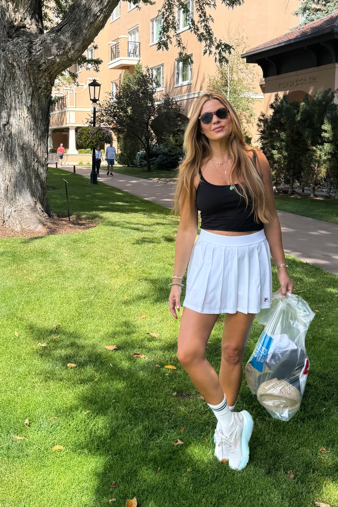 Really into these cotton tanks with built in shelf bras. Wearing a size medium. Skirt is small and shoes run TTS  👟 

#LTKTravel #LTKStyleTip #LTKFitness