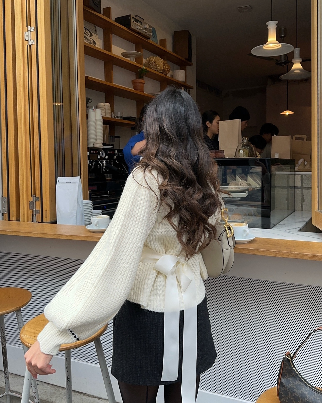Wore this cream cardigan with this wool skirt and penny loafers for a day of exploring in Paris 🤍

#LTKtravel #LTKstyletip #LTKwinter