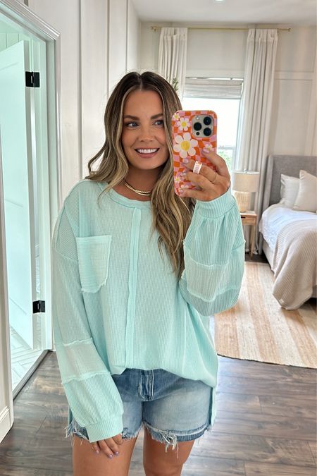 The details of this top! I love how it fits like a sweatshirt but has the gauze detailing & waffle knit texture! Super comfy!! 

Wearing size medium. Code BrittH20 works on entire outfit! 

Spring outfit, spring top, denim shorts 
