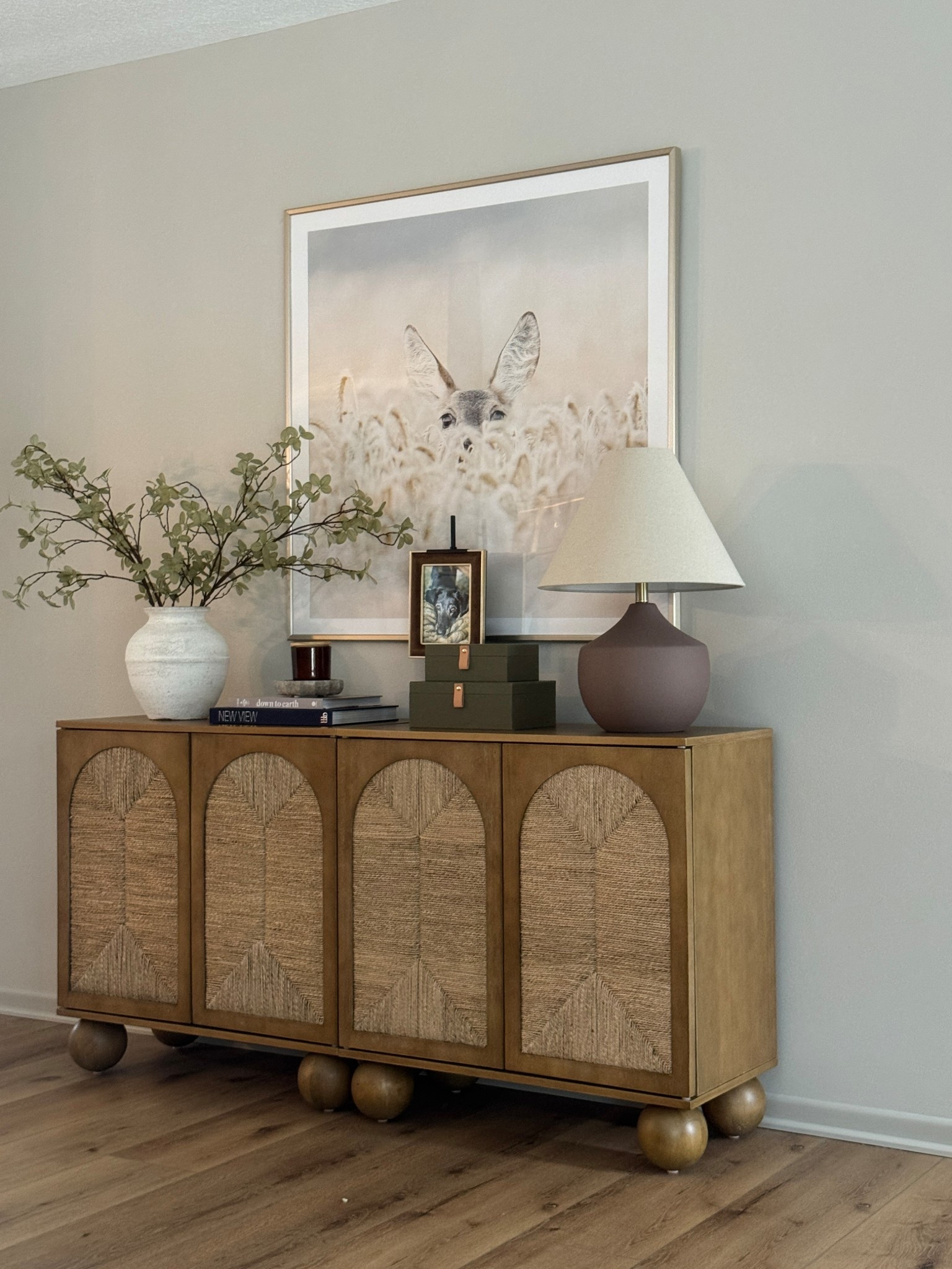 Console table refresh with all the fun spring things!! Loving these green decorative boxes, they bring such a nice balance to the greenery in the vase. As always, I have more neutral decor spread about like the marble candle holder I’m obsessed with. 
#homedecor #decorativeboxes #tableconsole #tablelamp #homedecor #interiordecor #lamp

#LTKHome