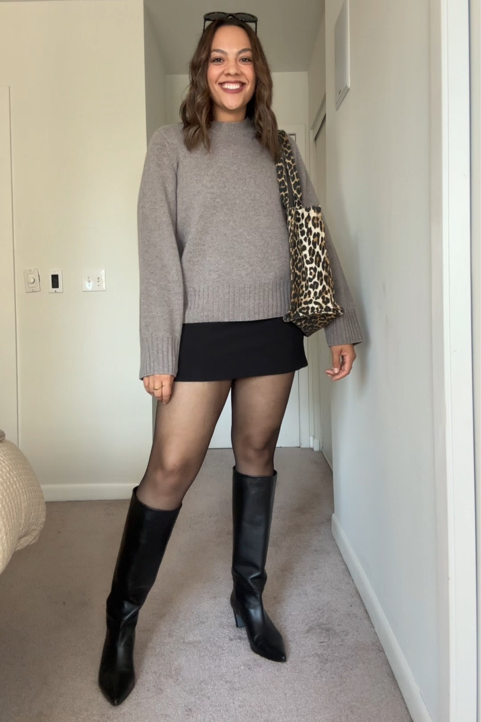 Fall outfit idea featuring a crewneck sweater!
-Reformation taupe wool crewneck sweater, I have a size large.
-Black mini skirt, similar linked.
-H&M sheer tights, I have the size large.
-Poppy Barley black knee-high leather heeled boots, I have calf with three.
-Ganni leopard print tote bag.
-Celine Triomphe sunglasses. 

#LTKstyletip #LTKcanada #LTKautumn