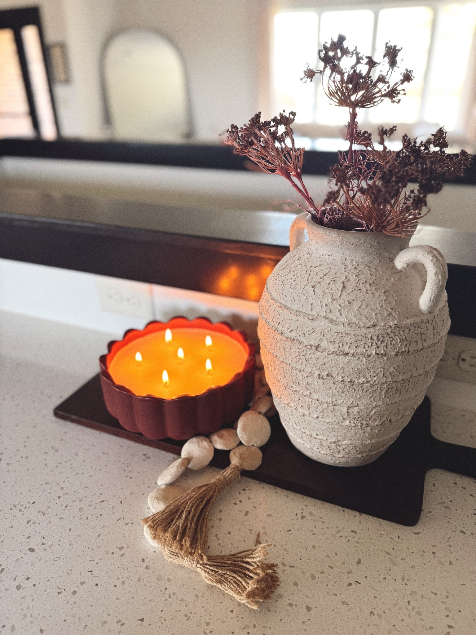This scalloped red candle is such a vibe ✨ Paired with my Hobby Lobby textured vase + wood beads, it instantly feels warm, layered, and seasonal. Vase is hobby lobby 🕯 #LTKhome #fallhomedecor #LTKfinds #cozyhome #ltkbest #neutralhome #homedecorinspo