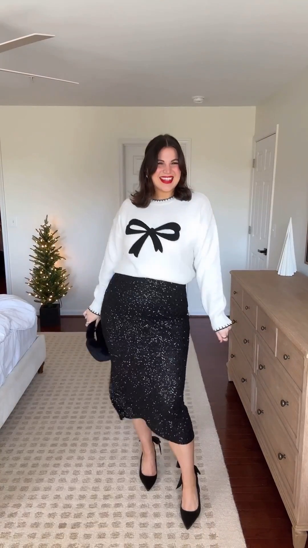 Midsize holiday outfit! You can never go wrong with sequin skirt for the holidays!! And I love this one paired with this adorable bow sweater 🥺 its giving cute + cozy but festive 🎄 

Skirt + sweater - size xl *you can save on them with the code : KELLY15 
Robe - xl 
Bralette - size xl *you can save with code:  KELLYTK20 
Heels - 9.5 

Holiday outfit, holiday style, holiday fashion, midsize, midsize outfit 



#LTKMidsize #LTKHoliday #LTKSeasonal