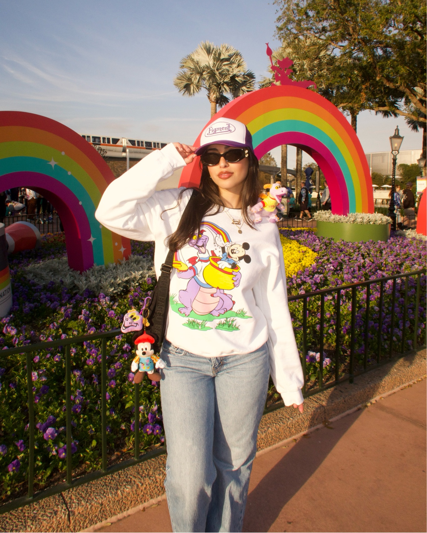 Epcot FOTA outfit 💜
Hat is thegreenhillsclub on ig
Sweatshirt is shopkachowvintage on ig
Keychains are form Disney parks 