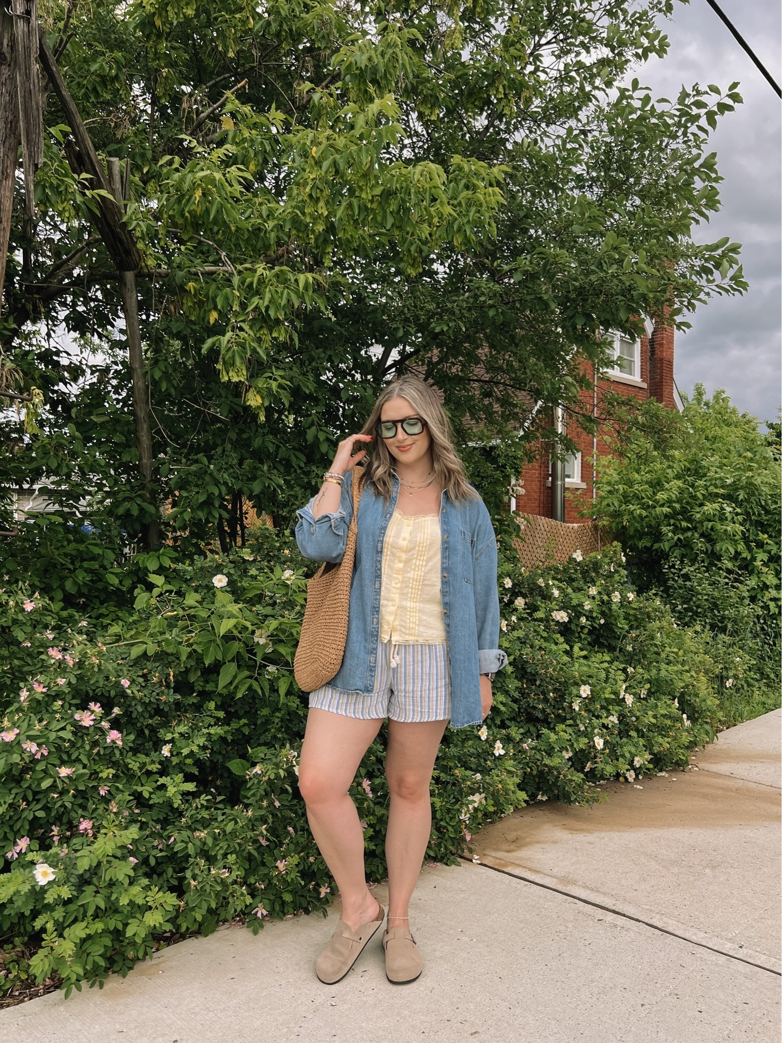 Easy summer outfit! Canadian links are under “similar products”. Wearing my usual size L in the striped shorts, butter yellow tank top, and oversized denim shirt. Straw tote bag is one of my fave Amazon finds! Linked similar clogs

#LTKsummer #LTKmidsize #LTKsale