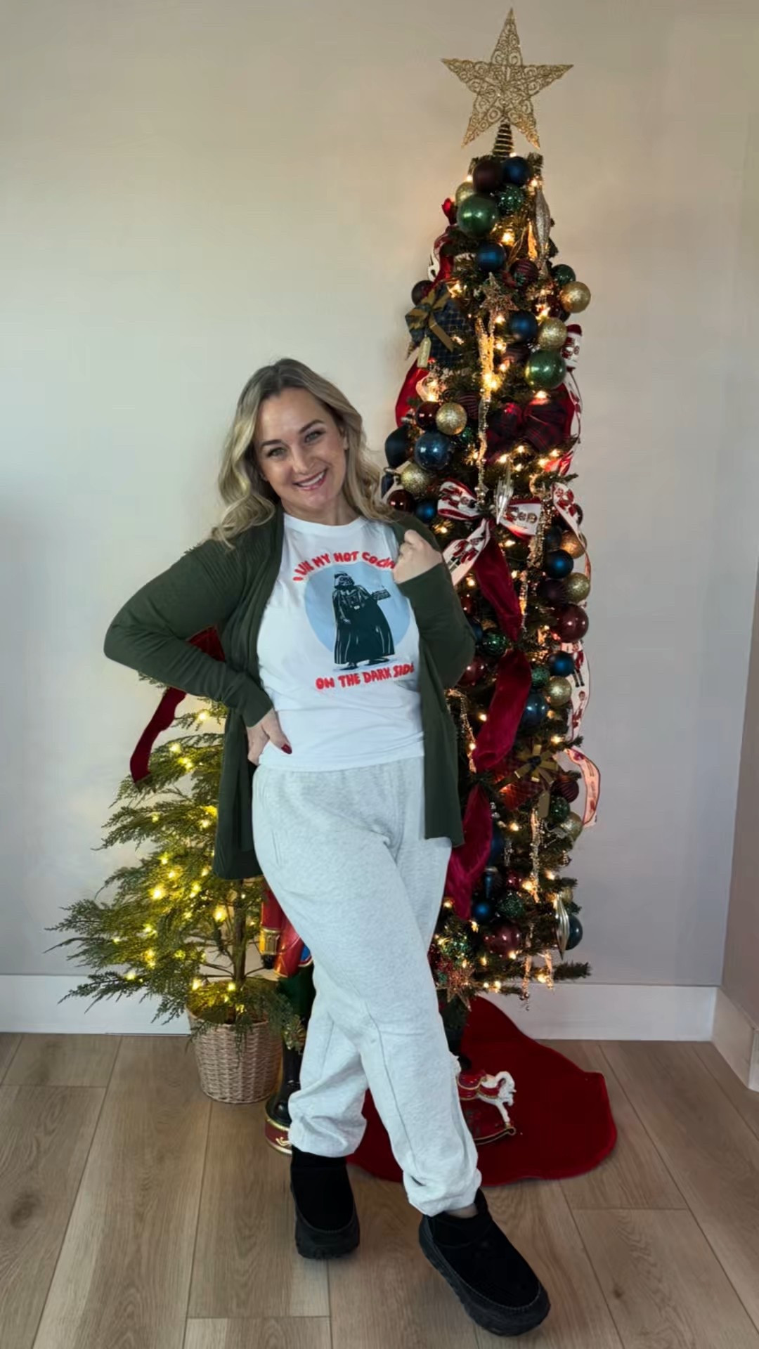 Day 17 of 25 🎄🖤
Cozy, casual, and a little cheeky. A festive graphic tee layered with a cardigan, comfy joggers, and cozy boots — perfect for movie nights, errands, and all-day holiday lounging.

Because not every Christmas outfit needs sparkle… some just need comfort. ✨
#Day17Of25 #ChristensenChristmas #HolidayCasual #ChristmasLoungewear #CozyChristmas #FestiveButComfy #HolidayOOTD

