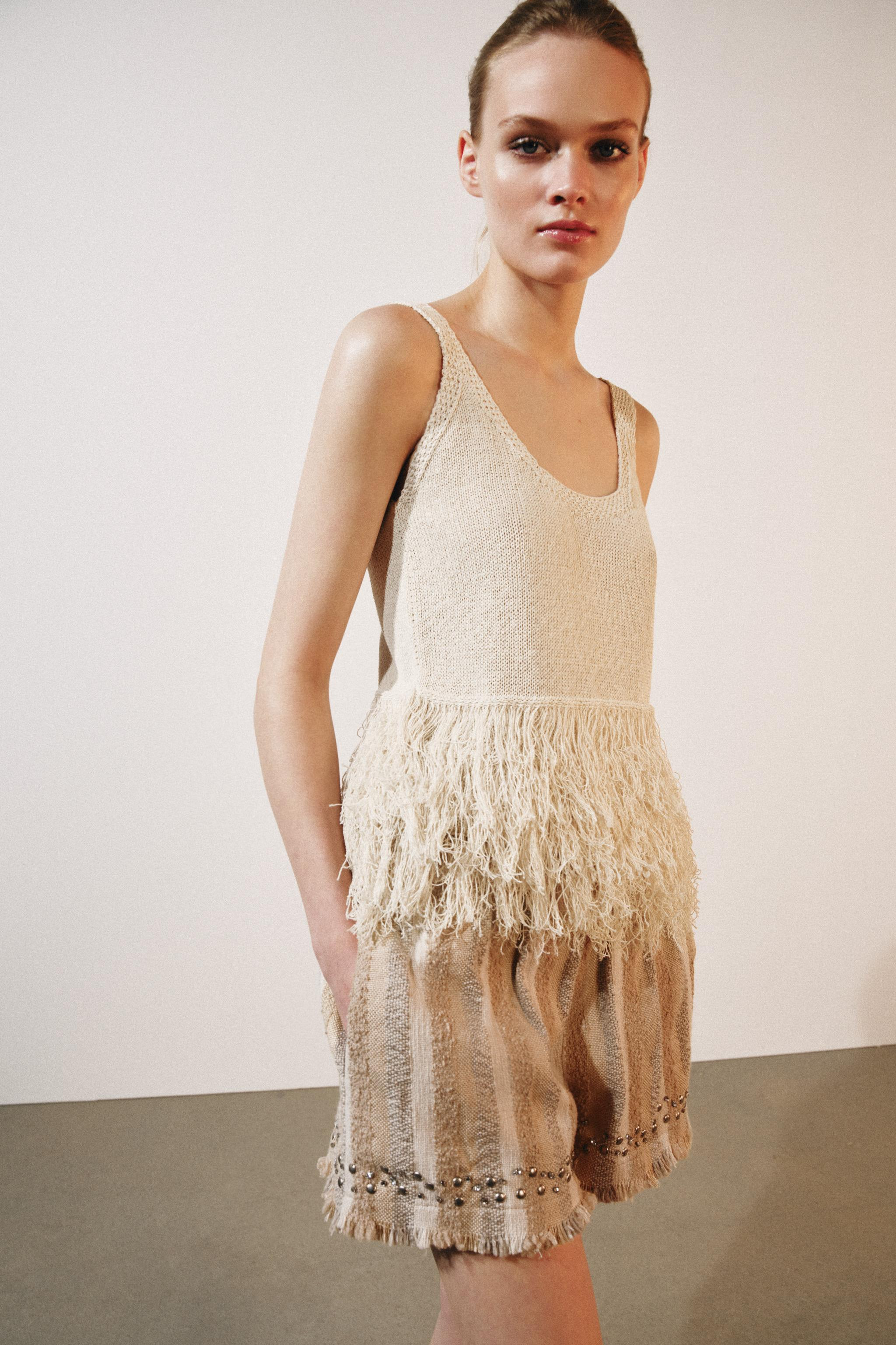 Round neck top with wide straps and a fringed hem. | Zara US