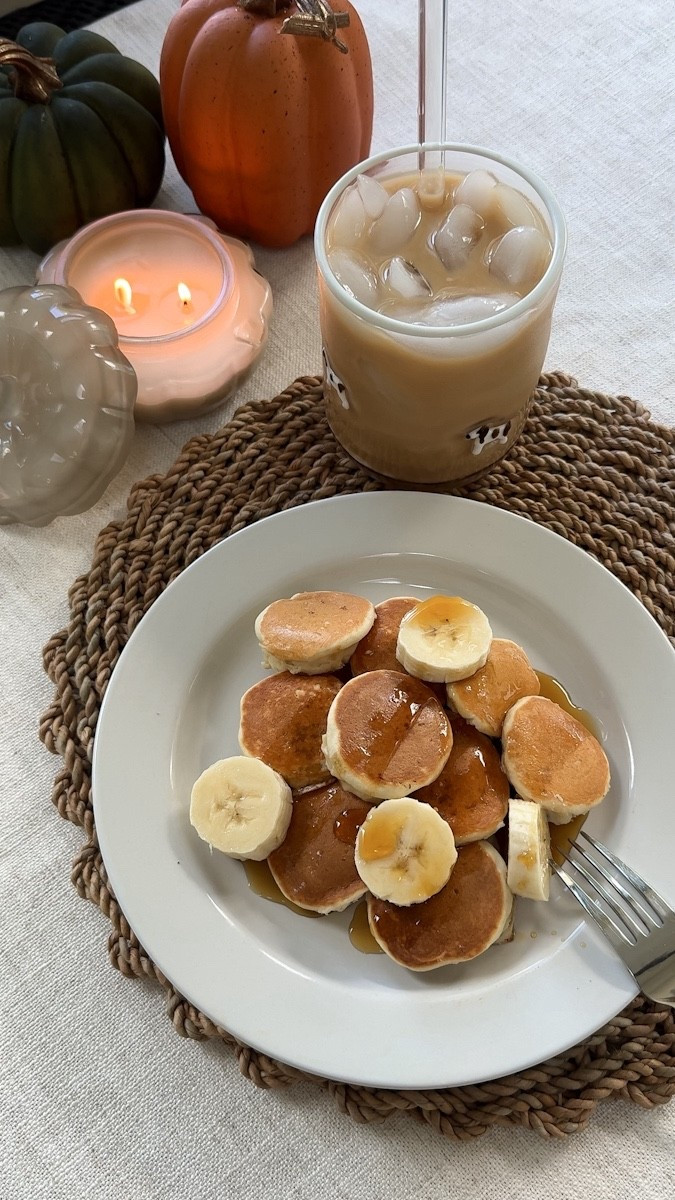 Make breakfast with me!! Super easy mini banana pancake bites & pumpkin spice iced coffee 🤍🍌🥞

I dipped banana slices in @krusteaz sweet cream pancake mix (just add water!) and cooked until golden. My cute lil doggie coffee cup is from @anthropologie & used @chobani pumpkin spice coffee creamer.

Kitchen, recipe, food, candle, fall, autumn, decor, aesthetic, bananas, cozy, cozy vibes, Amazon, anthropology 

#LTKFallSale #LTKHome #LTKSeasonal