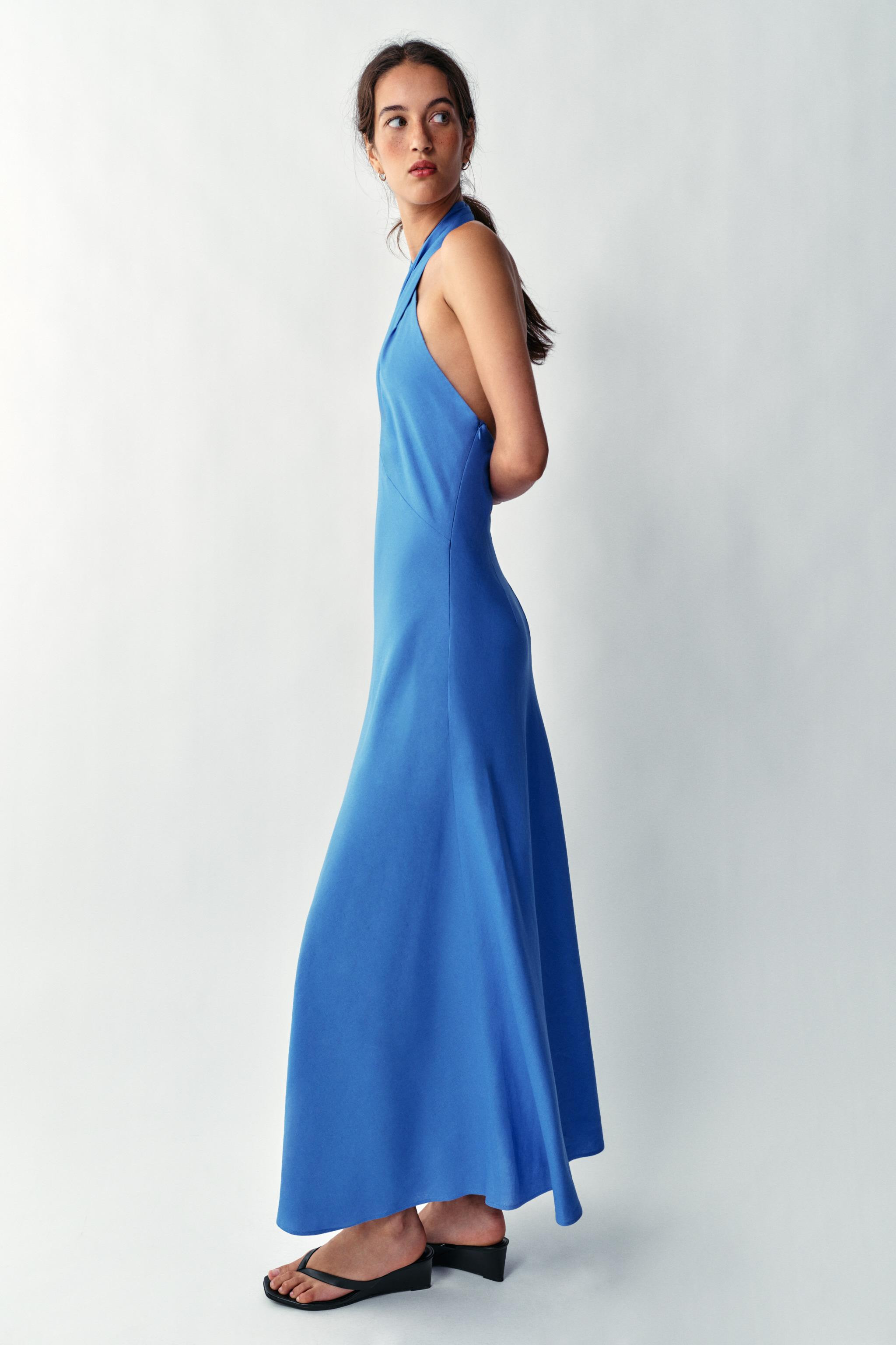 Midi dress made with linen. Crossed halter neckline and open back. Back hidden button closure. | Zara US