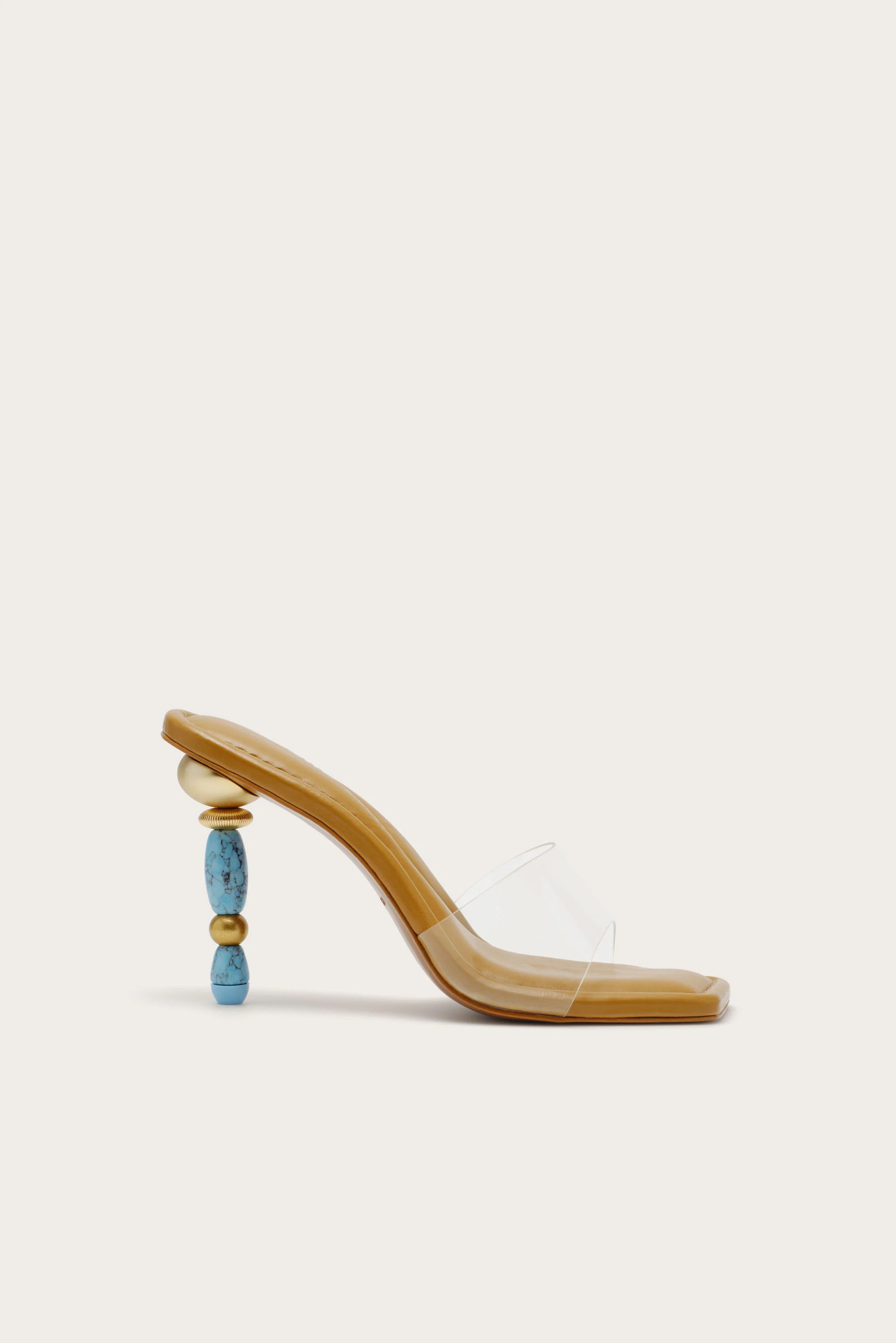 A high heel sandal with a clear toe strap and stiletto crafted from beads and faux turquoise ston... | Cult Gaia - US