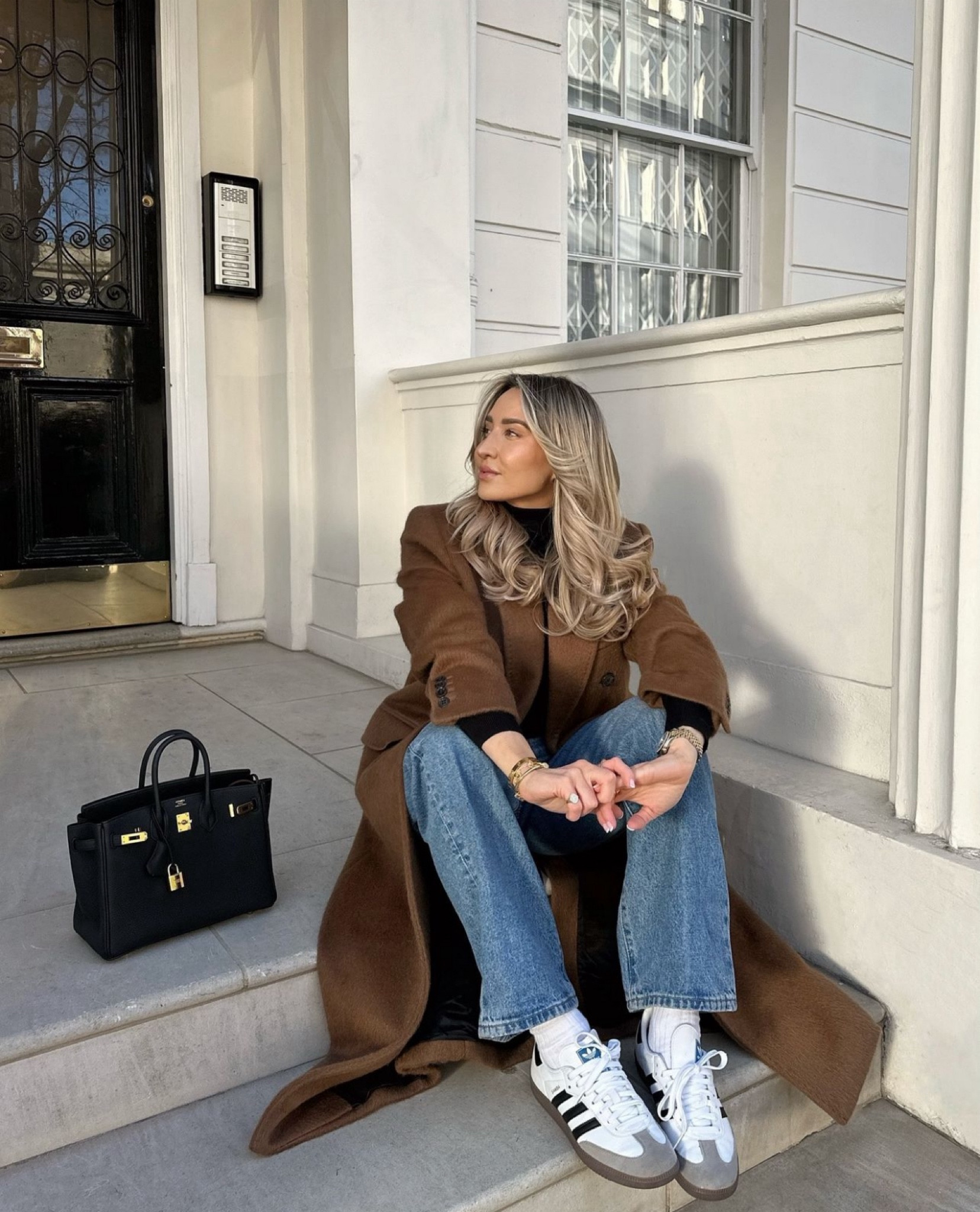 I love all these warm tones in Autumn 🤎🍂 long brown coat pops lovely against this black turtle neck and blue jeans, black Hermes accessories and Adidas 

#LTKautumn