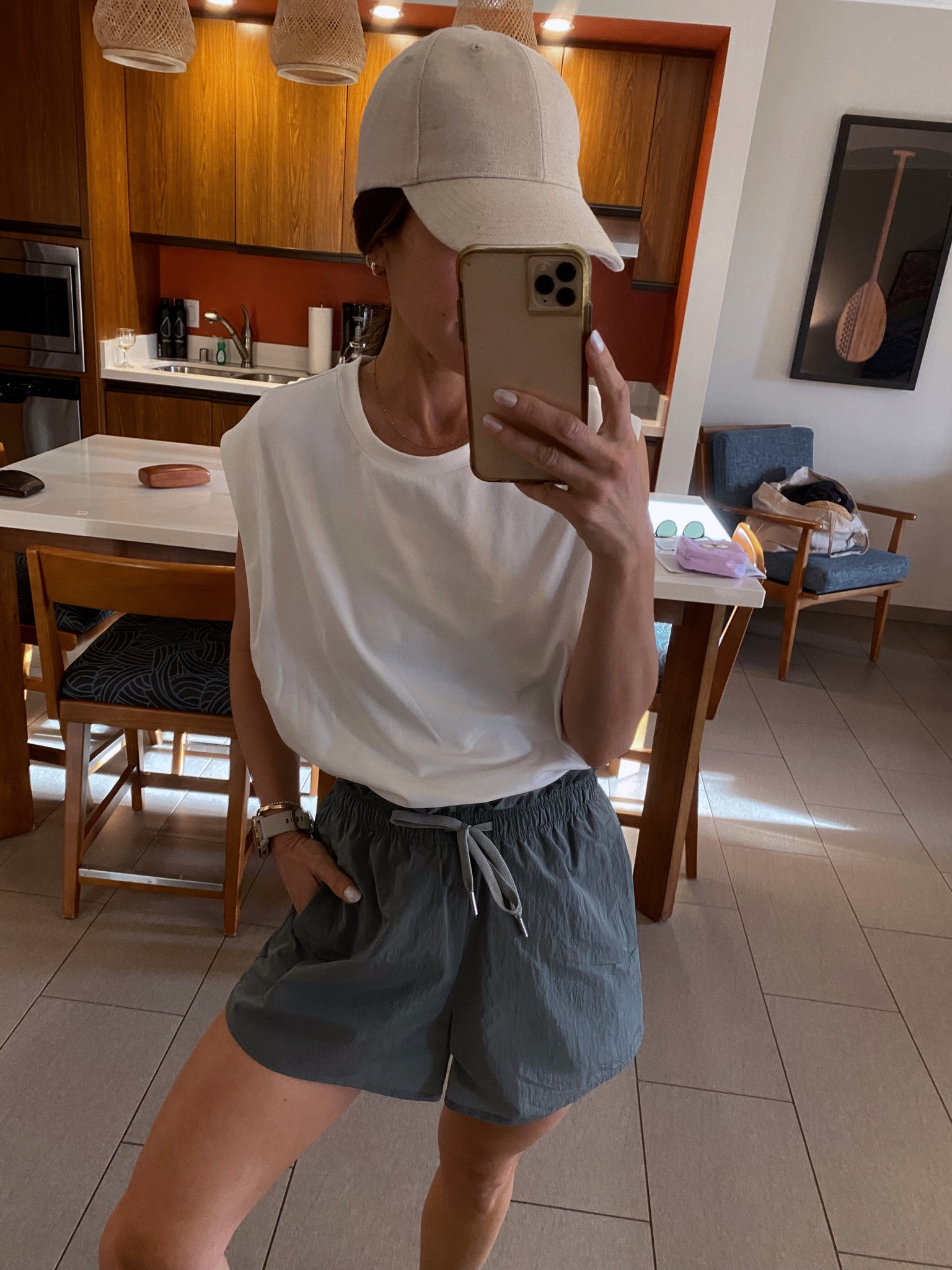 Morning walk along the beach 
Muscle tank (Tts, oversized fit) 
High waisted, unlined shorts 

#LTKstyletip #LTKfit