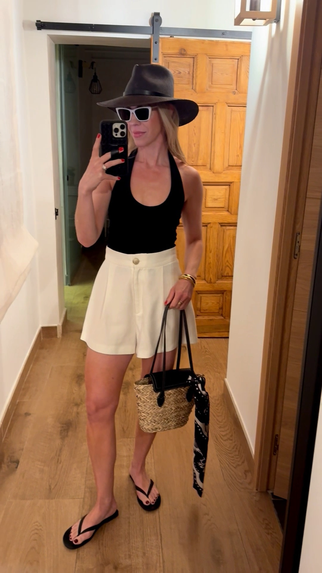Summer vacation outfit, Euro summer, halter top, white linen shorts, black thong sandals, @Janessa Leone black straw hat

#LTKTravel #LTKSeasonal #LTKSaleAlert
