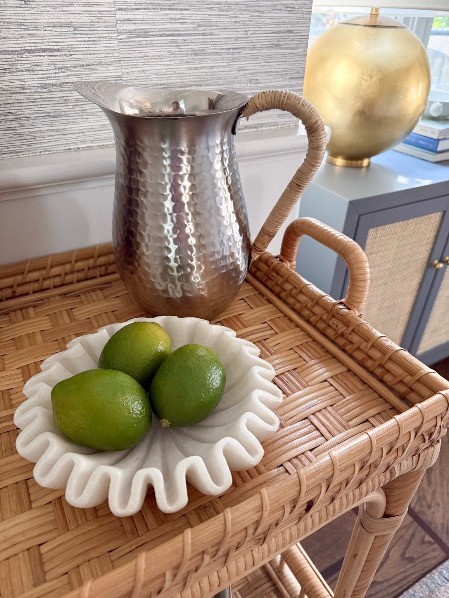 Such a pretty little styling moment. The woven bar cart, hammered pitcher, and sculptural bowl add so much texture while still keeping everything light and neutral.

woven bar cart, rattan furniture, hammered pitcher, decorative bowl, home decor finds, neutral home decor, bar cart styling, entertaining essentials, interior styling, girlonthehudson

#LTKHome #LTKSeasonal #LTKdayinmylife