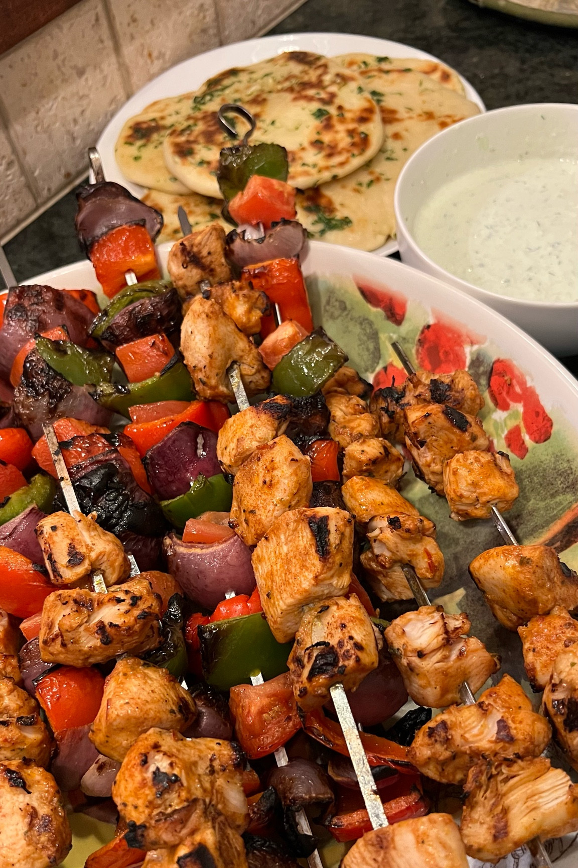 My brother got me @turkuazkitchen’s cookbook for Christmas and I told him to pick out something for us to make together! This weekend we headed to my Mom’s and made:

- Chicken Shish Kebabs with Cacık (Turkish Tzatziki)
- Garlic Naan

I am now forever spoiled with fresh naan, might never be able to go back to the frozen kind! It was super easy to make too. And the chicken kebabs were so flavorful and delicious. As is normal with marinades, the fact that I hate sour cream and yogurt didn’t even matter. You should have seen me making the marinade for the chicken 🤣  (Thank goodness it doesn’t taste like it smells 🤪)

10/10 for both recipes!



#LTKFindsUnder50 #LTKHome