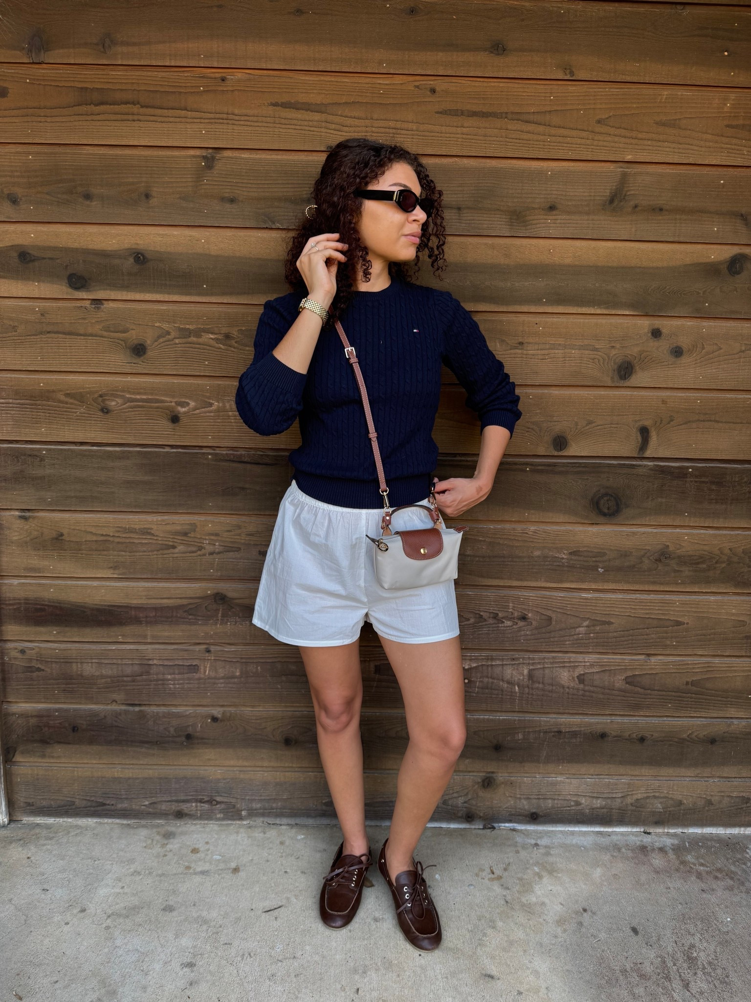 Preppy spring outfit: white boxer shorts, boat shoes, Longchamp mini, cable crew sweater 

#LTKSeasonal #LTKootd