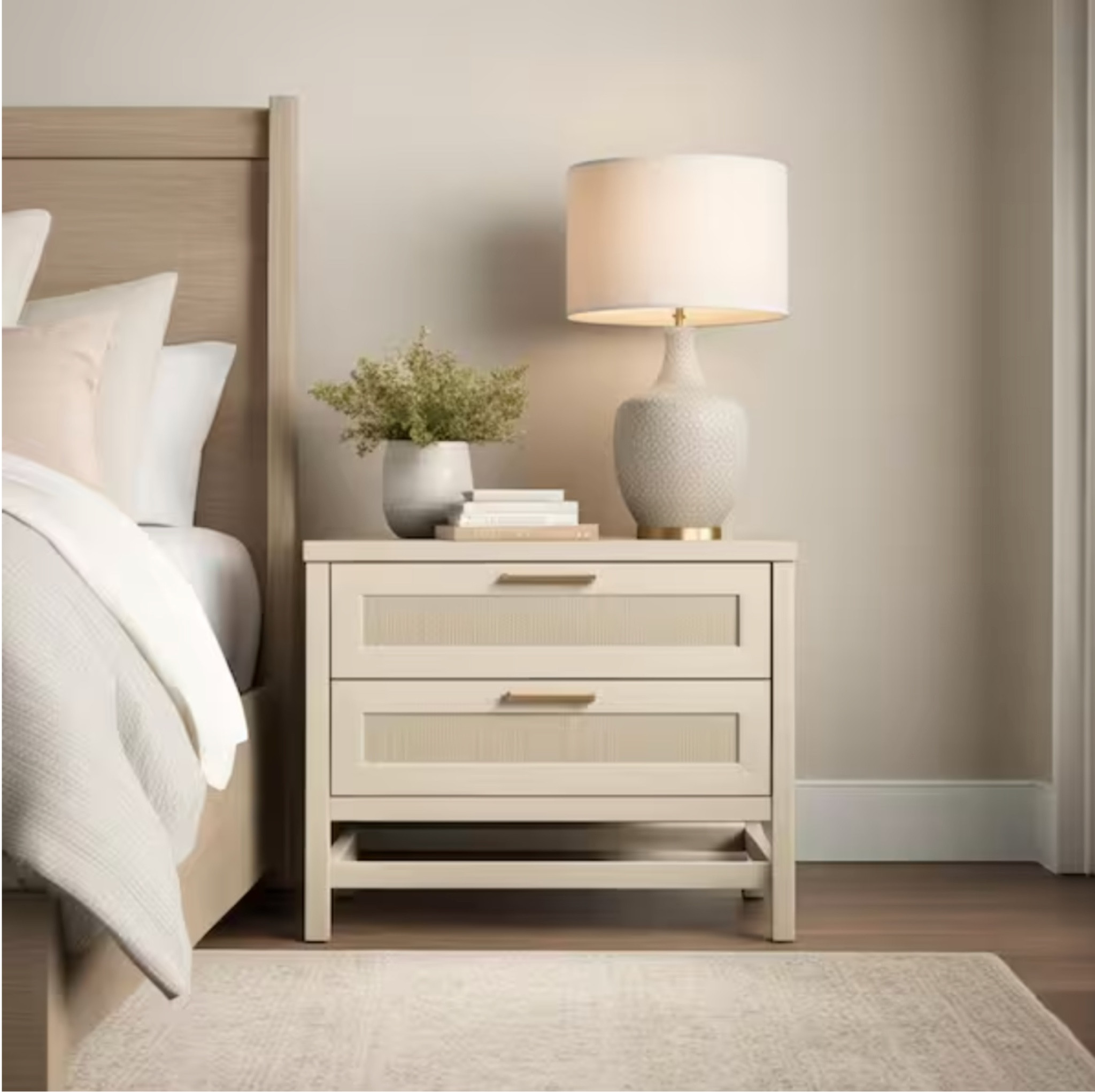 2-Drawer Ivory Oak Nightstand

Give your bedroom a boho-chic upgrade with the Ameriwood Home Leeland 2 Drawer Nightstand. The tabletop will keep reading materials, glasses, and electronics within reach. The 2 drawers are perfect to store away cords, puzzle books, or stationary to keep your tabletop clutter-free. Made of laminated MDF and particleboard, the off-white woodgrain finish pairs with the faux rattan drawer fronts for a fun coastal look.

#LTKHome