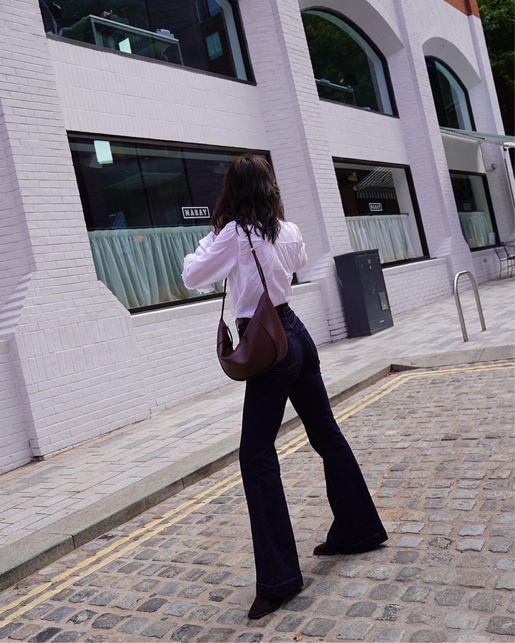 boden clothing 
flared jeans 
broderie blouse 
wandler bag 
slouchy bag 
velvet canyon sunglasses 
casual outfit 

#LTKeurope #LTKSeasonal #LTKstyletip