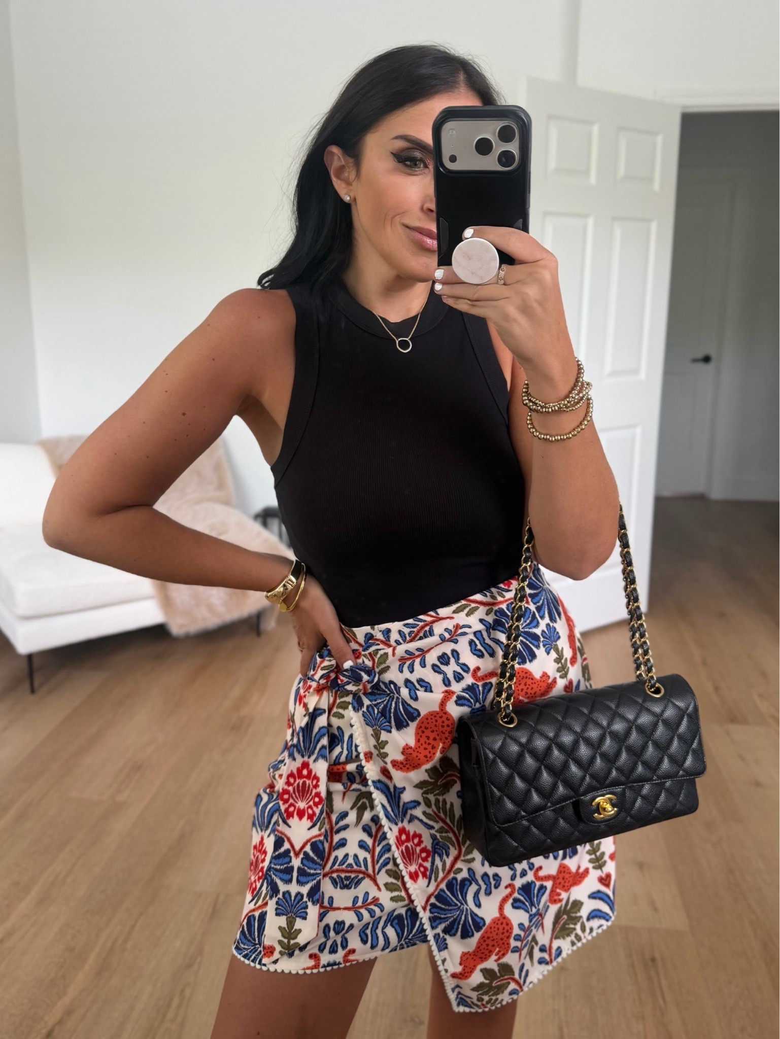 Black tank top wearing size small. Looks like Farm Rio skirt wearing size small