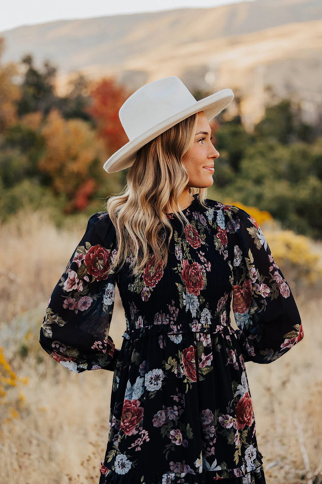 THE LAICEE SMOCKED FLORAL DRESS IN BLACK | Pink Desert