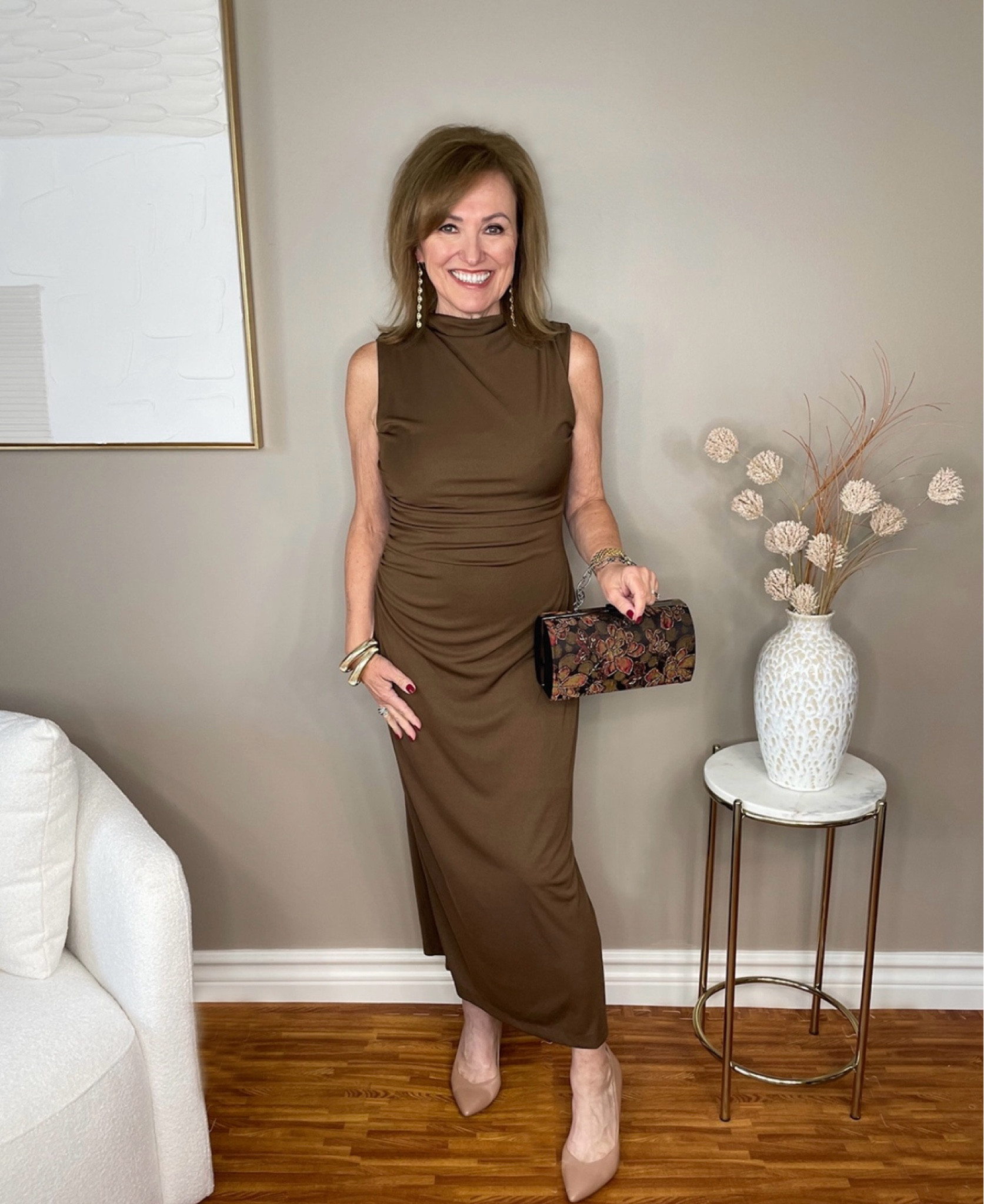 Here’s little more detail on my funnel neck dress from my fall trends video.

I recently wore this to a wedding and got so many compliments. I actually love brown and think it is so chic and elegant. The ruching on the dress makes it so you don’t have to worry about your stomach all evening! You can relax. Best of all, this dress is under $100!