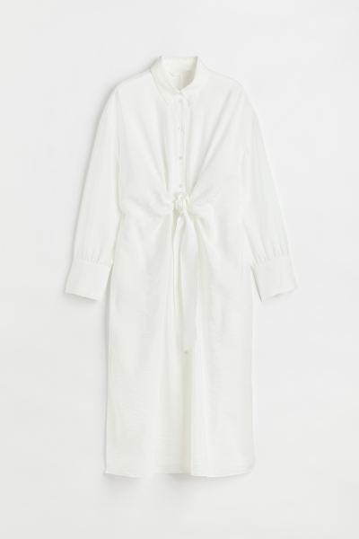 Calf-length dress in a woven viscose blend. Collar, buttons at front, yoke at back with box pleat... | H&M (US)