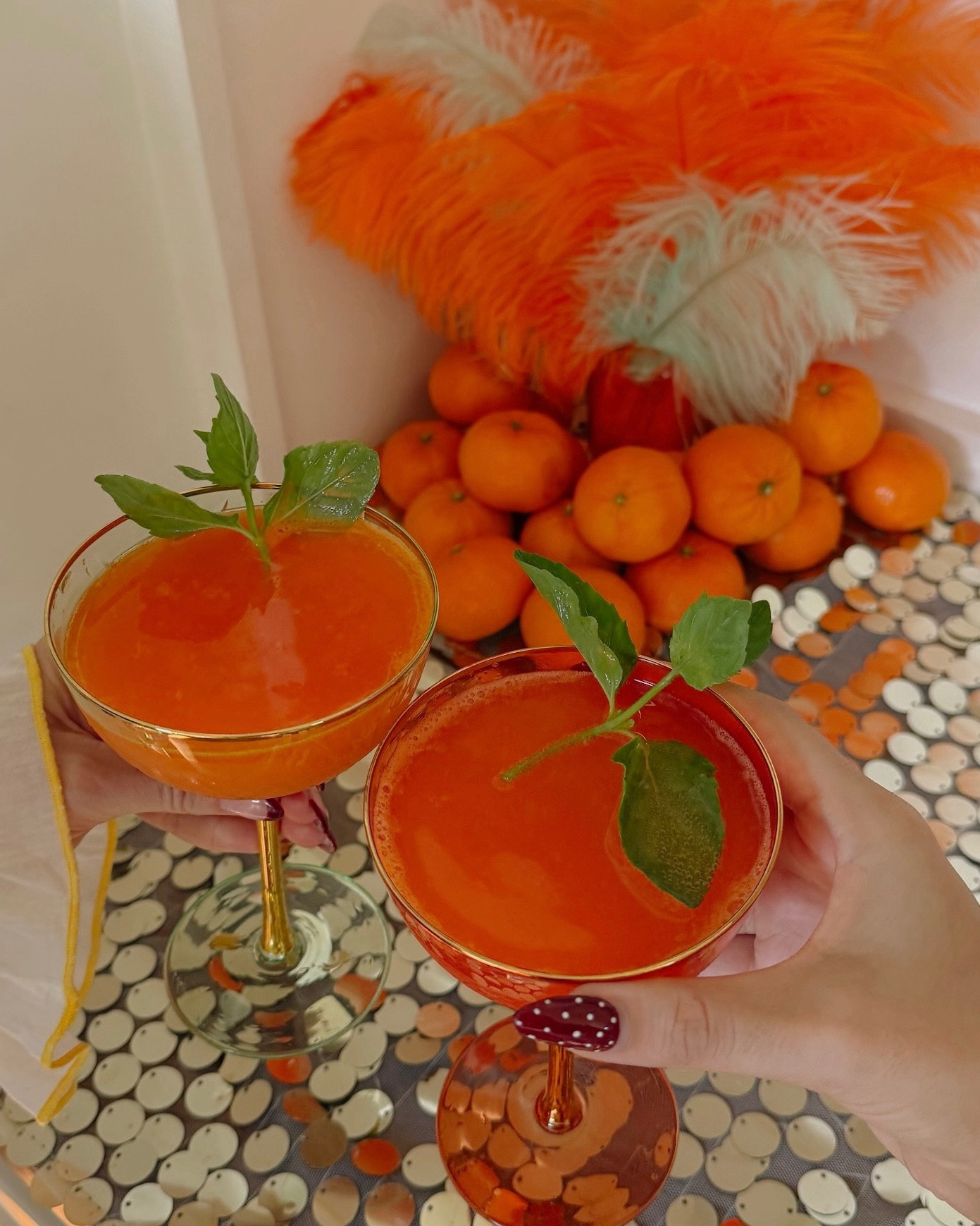 The life of a showgirl drink 
1 oz Cointreau
2 oz fresh mandarin juice
3 oz prosecco
2 oz blood orange sanpellegrino
1/2 teaspoon edible orange glitter
1 mint sprig
(Mocktail & spirit forward version on my website!)

Drink recipe, cocktail recipe, recipe, recipes, the life of a showgirl party, life of a showgirl party, life of a showgirl drink, recipes, orange cocktail, orange drinks, orange recipes, showgirl party, showgirl decor 

#LTKParties #LTKSeasonal #LTKFindsUnder100