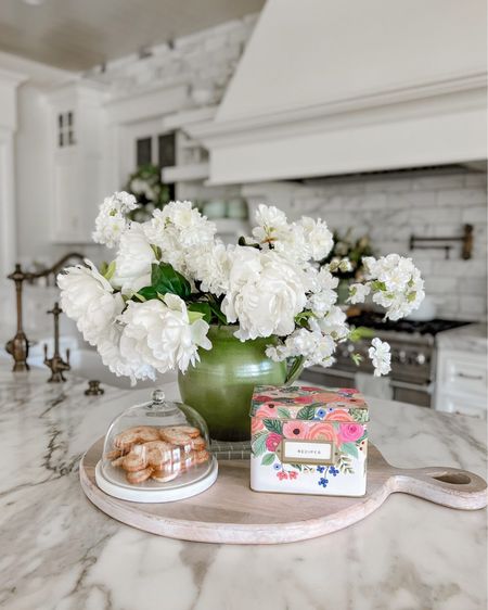 Another way to add in color and warmth to your kitchen that works for St. Patricks Day decor as well as Spring, is to add a charcuterie or cutting board to your island or counter and then add some flowers in a vase. I also used this cute recipe card holder and some cookies for snacking later.
Sharing similar items to recreate the look!

#LTKfamily #LTKhome #LTKSeasonal