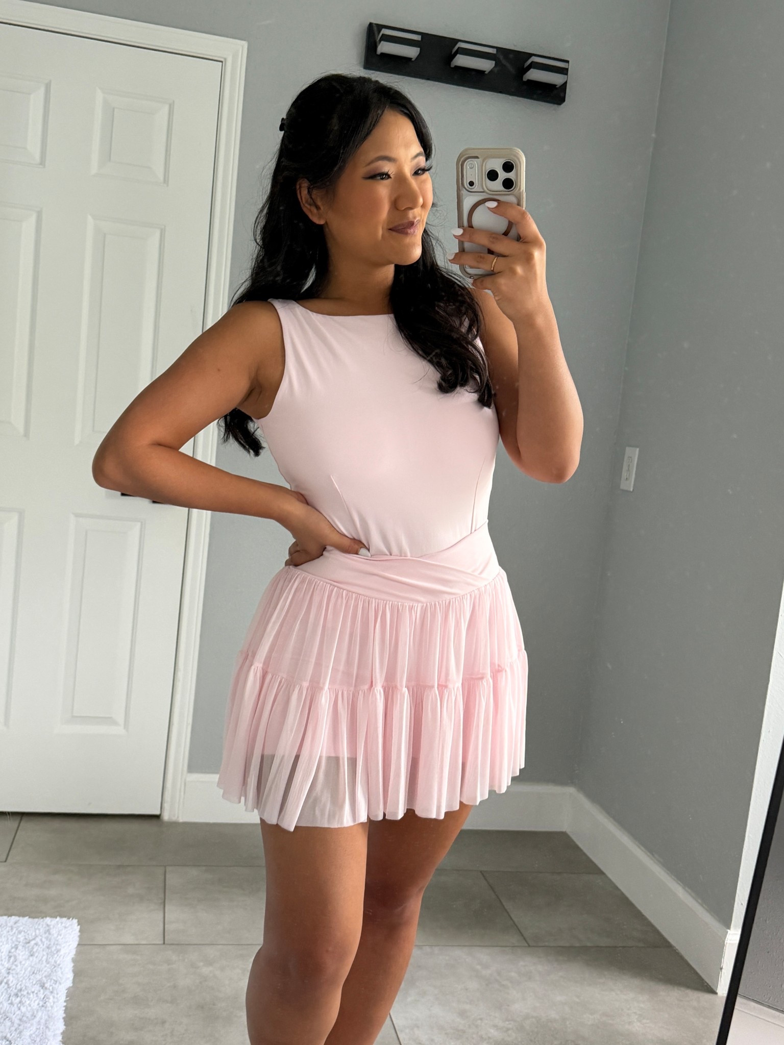 Blogilates Women's Ballerina Skort wearing size medium. Blogilates Women's Boatneck Crisscross Tank Top wearing size large. Blogilates Women's Marshmallow Full Zip Hooded Sweatshirt wearing size medium. 