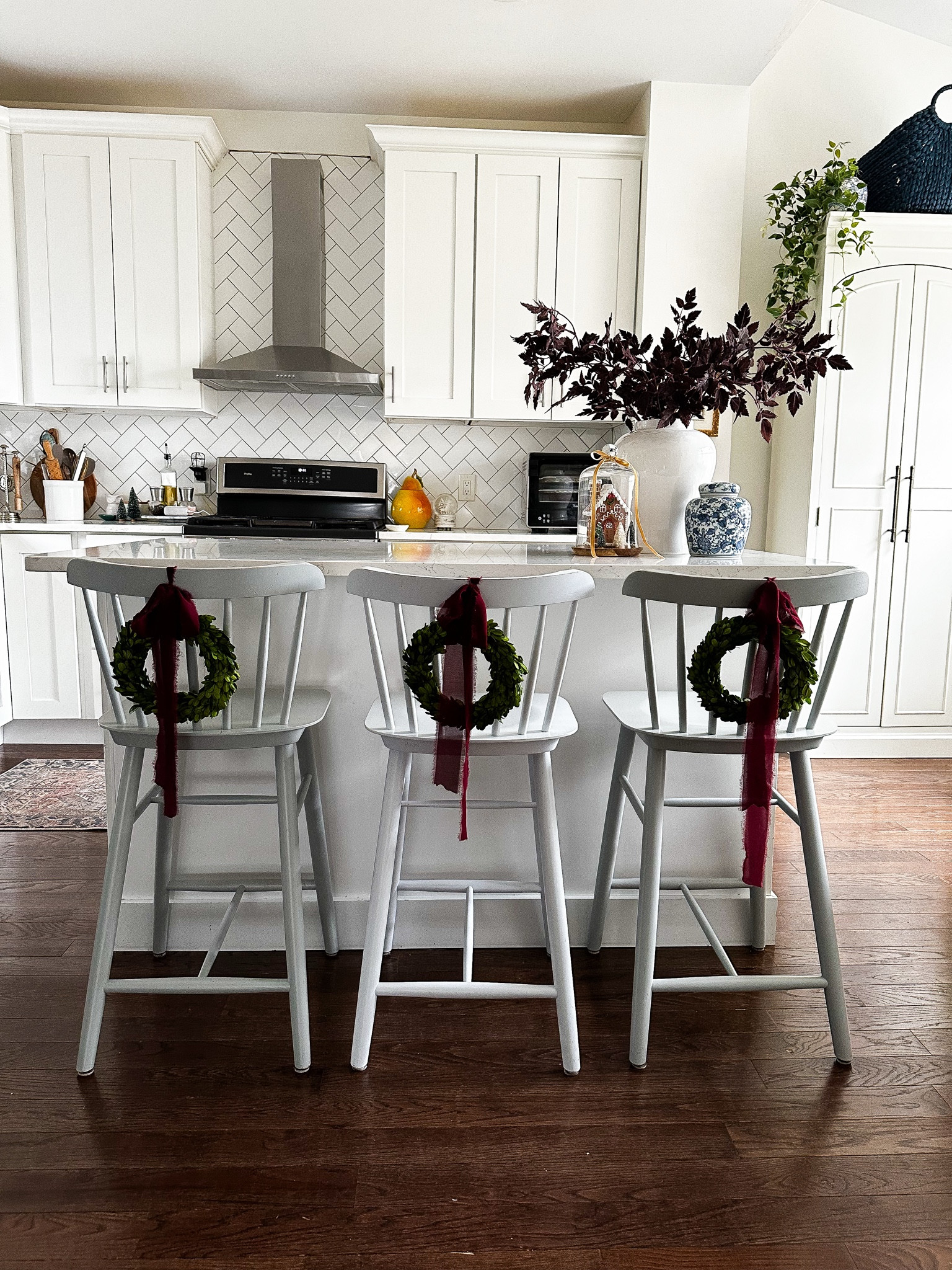 Christmas wreaths on chairs in kitchen. My fav. 

#LTKSeasonal #LTKHome #LTKSaleAlert