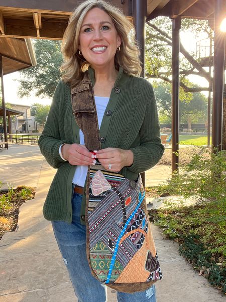 Casual style. Shaker style sweater. Lots of colors available.  Great quality. Fit is roomy. If between sizes size down one. Darling stretchy embroidered cropped denim. Run tts. Fabulous artsy slug crossbody bag. 

#LTKitbag #LTKshoecrush #LTKover40