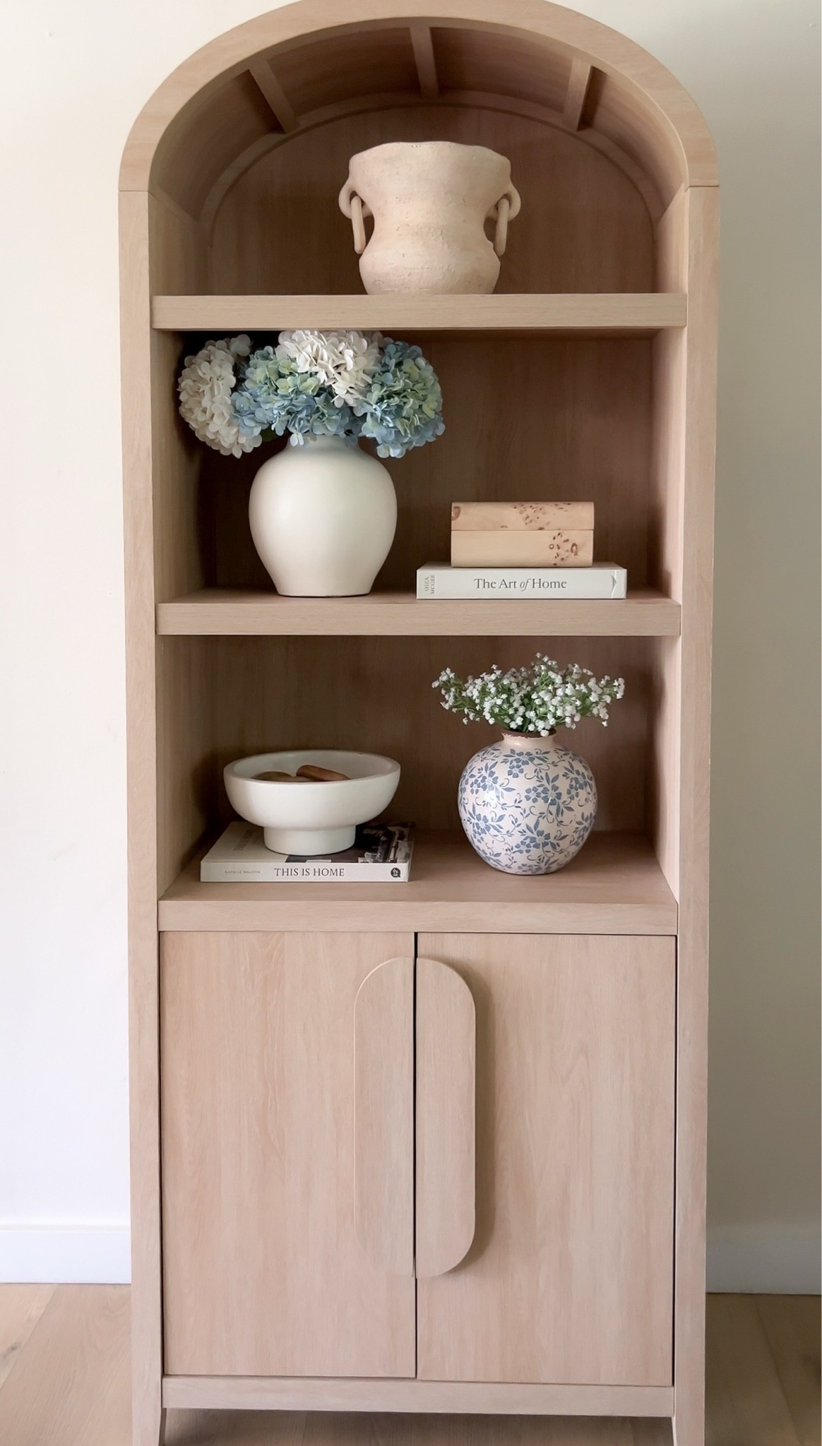 White and blue arched cabinet decor

#LTKHome