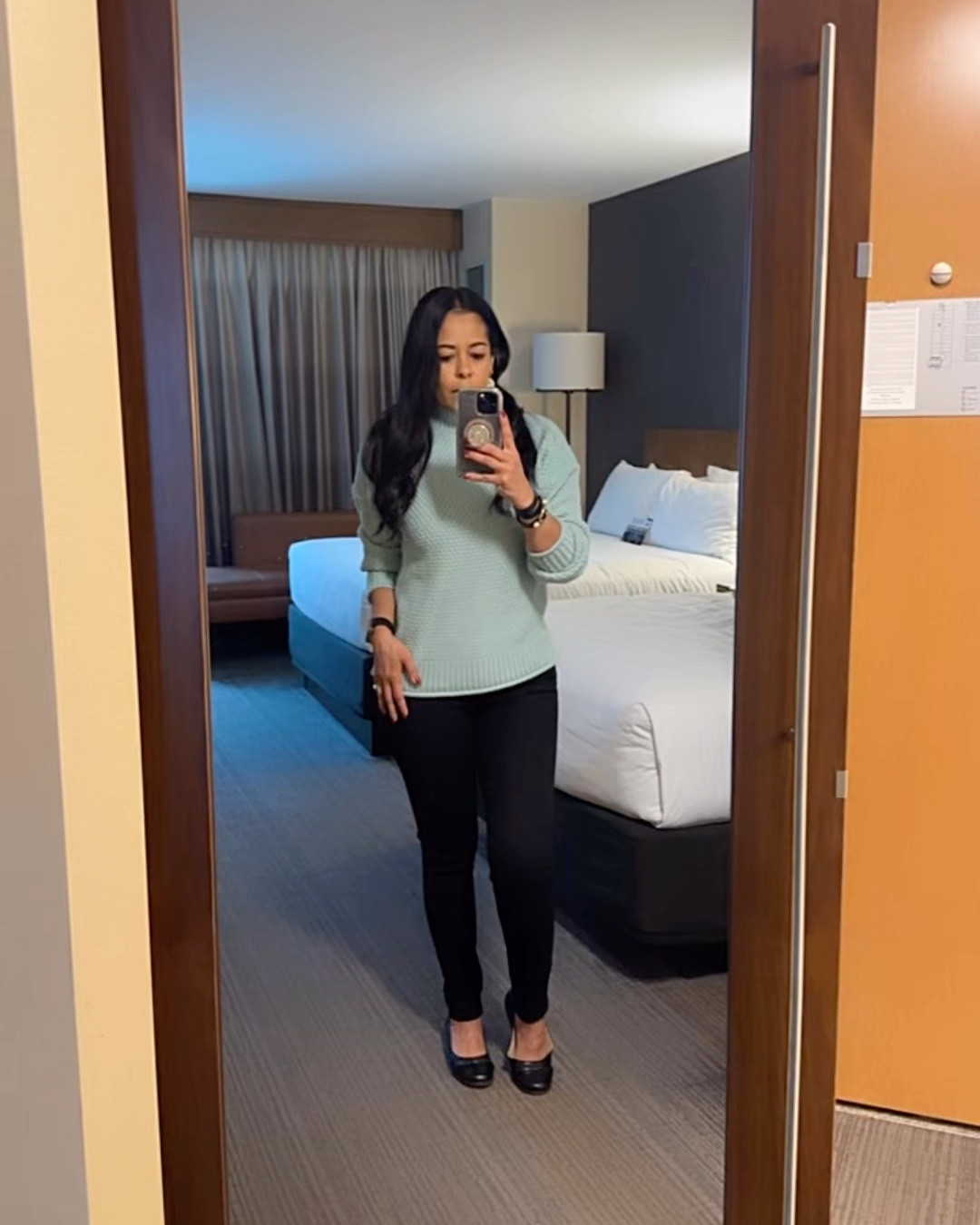 Spring weather outfit 
Black jeans 
Light rain shell
Flats 