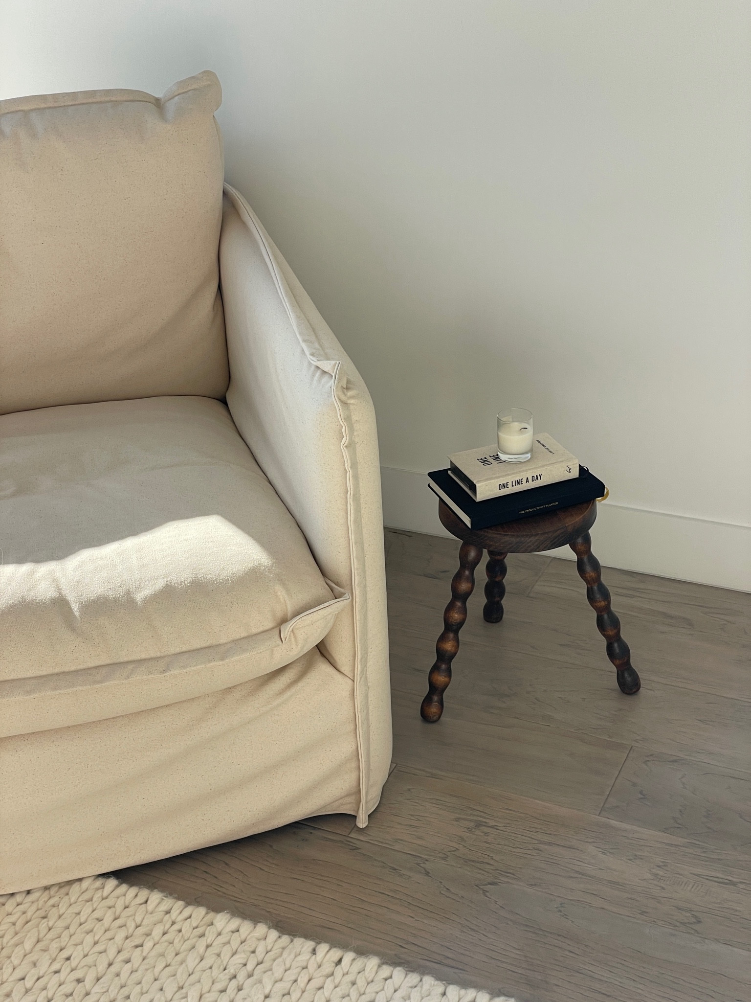 My reading book🫶🏼 love these little stools all over the place. Chair is similar 

#LTKhome