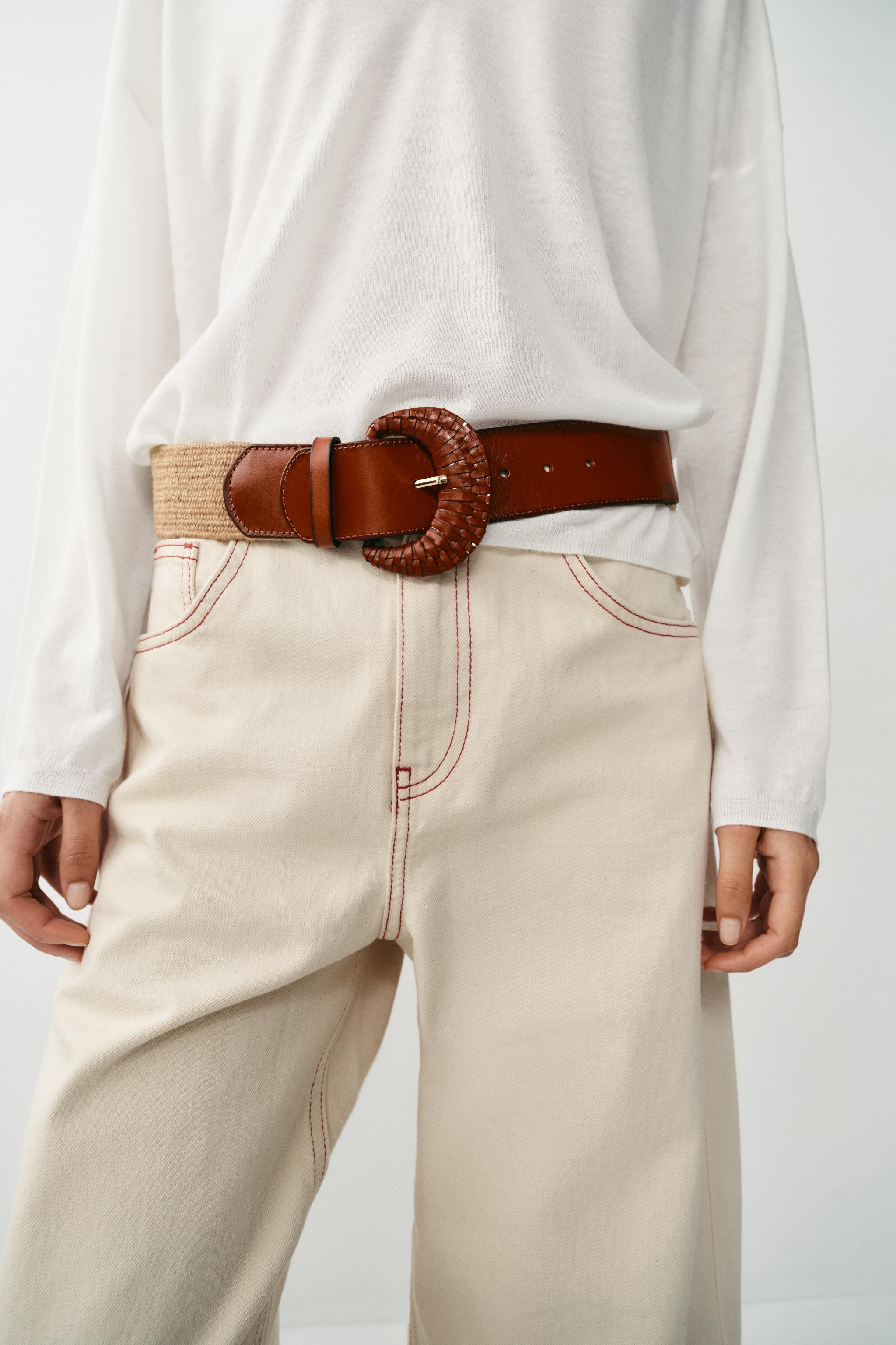 Elastic belt, 5 cm wide, made from jute. Features an oval, engraved buckle with the main componen... | Zara DE