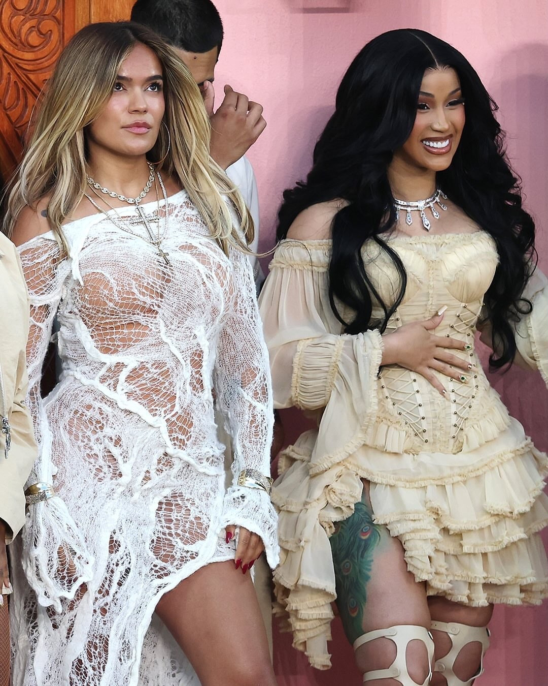 Cardi B wore a white Zimmermann Rebellion corset priced at $1,557, paired with a coordinating skirt fashioned from deconstructed Zimmermann pieces. She completed the look with vintage Tom Ford gladiator heels valued at $3,895 and jewelry by Messika, leaning into a mix of archival glamour and modern edge. The layered textures and sculptural elements of the outfit stood out under stadium lights, aligning with the theatrical scale of the halftime show.