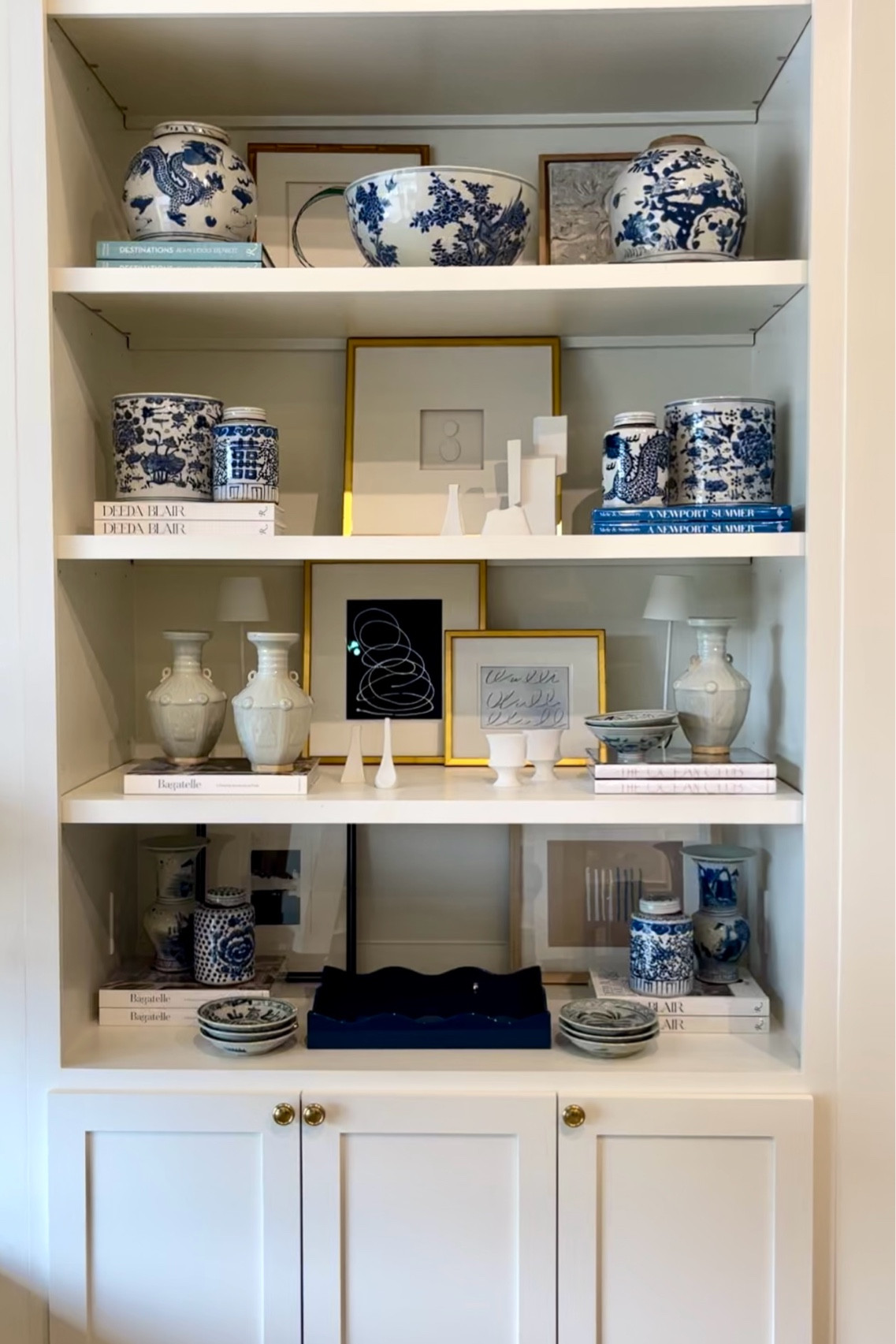 The golden rule for styling a bookshelf? Always include books! They offer versatile options to fill the space and infuse personality. Consider adding art, pottery, framed family photos, bowls, or bud vases to elevate the decor and showcase your unique story.

#LTKhome #LTKstyletip