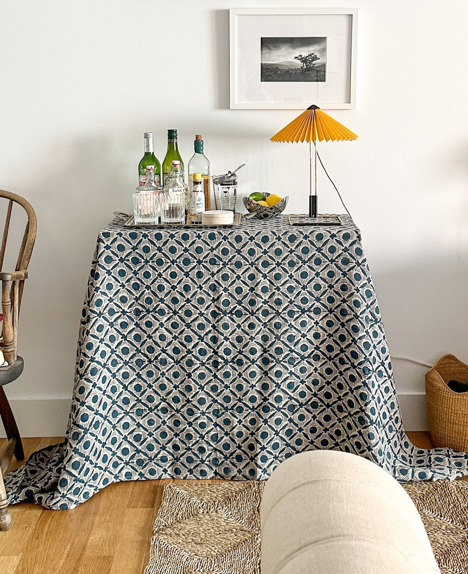 For my at home bar, I created my own skirted table. It was so easy. I just covered a cheap Amazon shelf with a beautiful linen tablecloth and reinforced the shelves with a bit of foam core. I love the pop of color and bold pattern it adds to the room, and it provides storage for liquor bottles and glassware. I’m sharing what I used, or similar items, to create my skirted at home bar.

#LTKhome