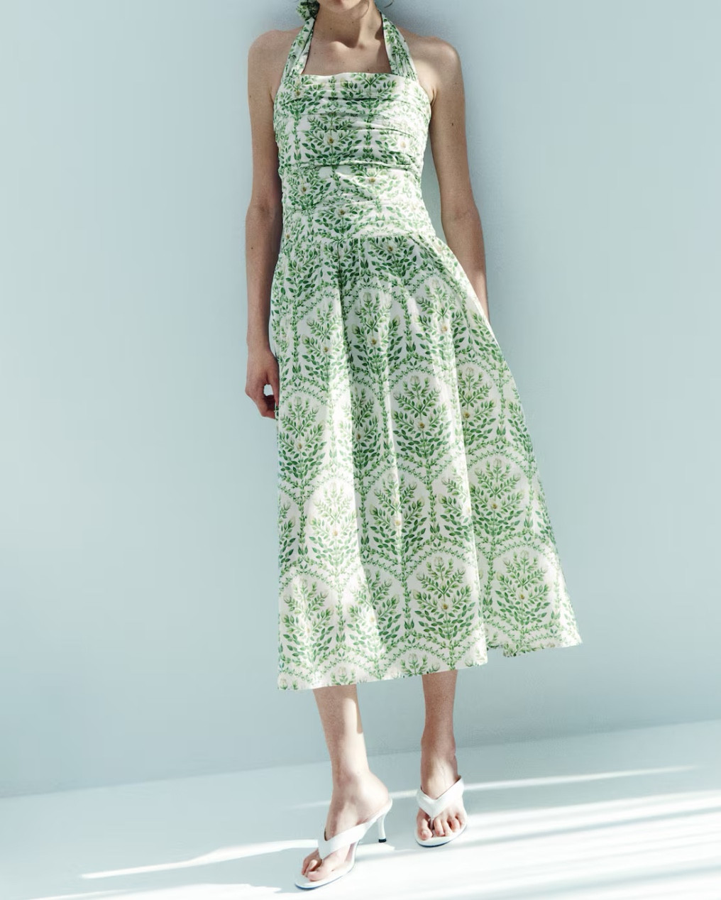 Green and white floral halter neck midi dress 

#LTKSeasonal