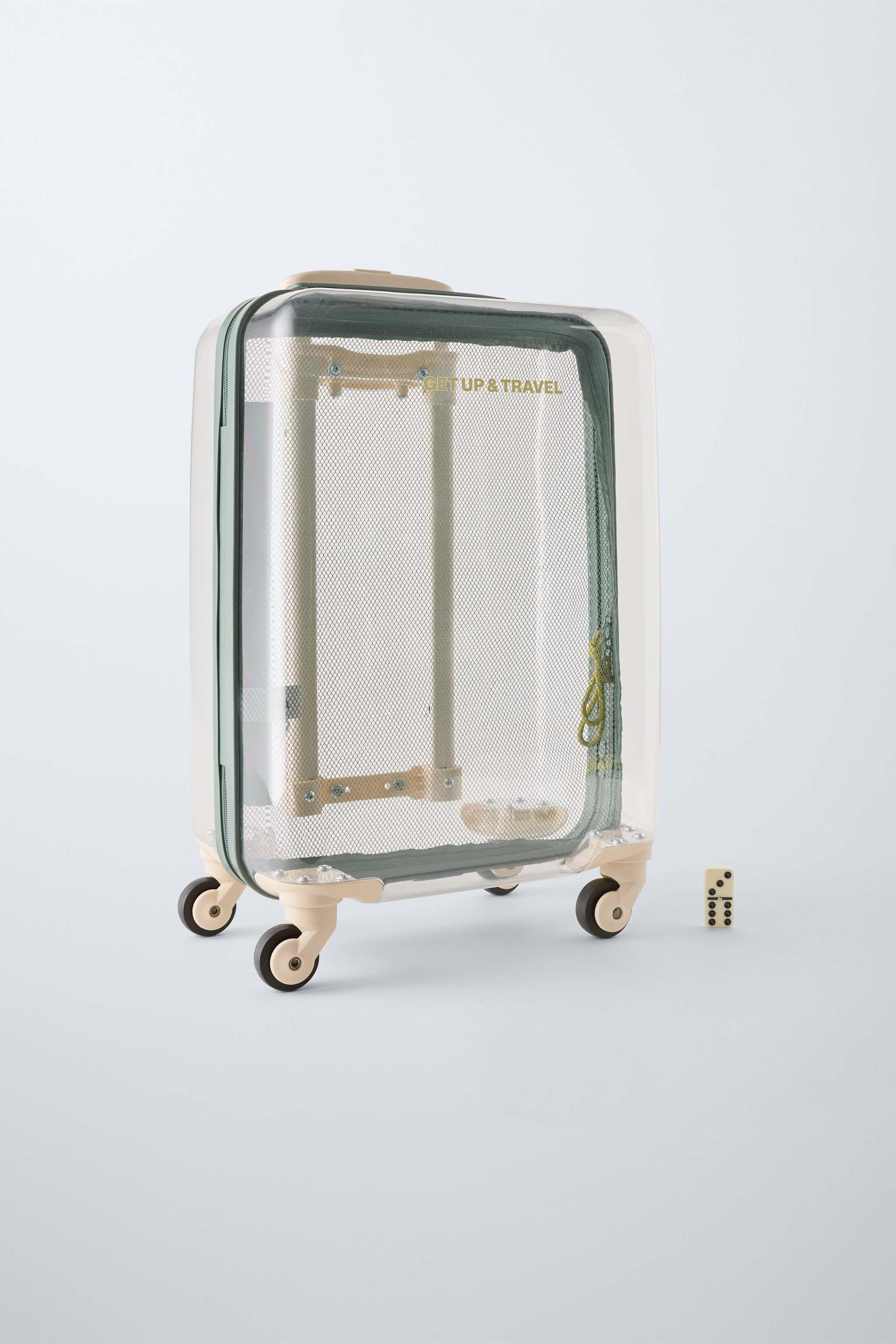 Transparent travel suitcase. Zip closure. Extendable pull handle with two height settings and a t... | Zara UK