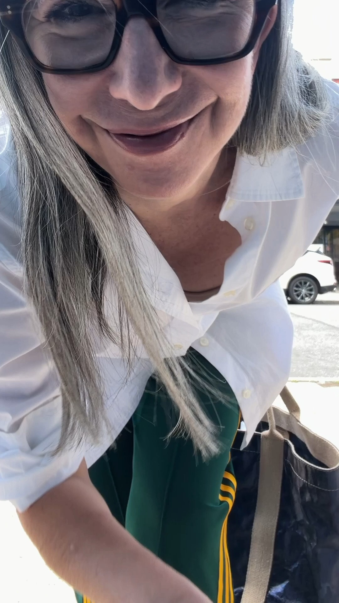 Gap oversized white poplin button front shirt, green Adidas track pants, black Havaiana flip flops - casual errand outfit, sporty meets relaxed. Shirt, pants, and flip flops linked. The linked track pants are the same style with a white stripe (mine are the yellow). Bag is Uashmama, not on LTK. @adidas

#LTKgrwm #LTKootd #LTKOver40