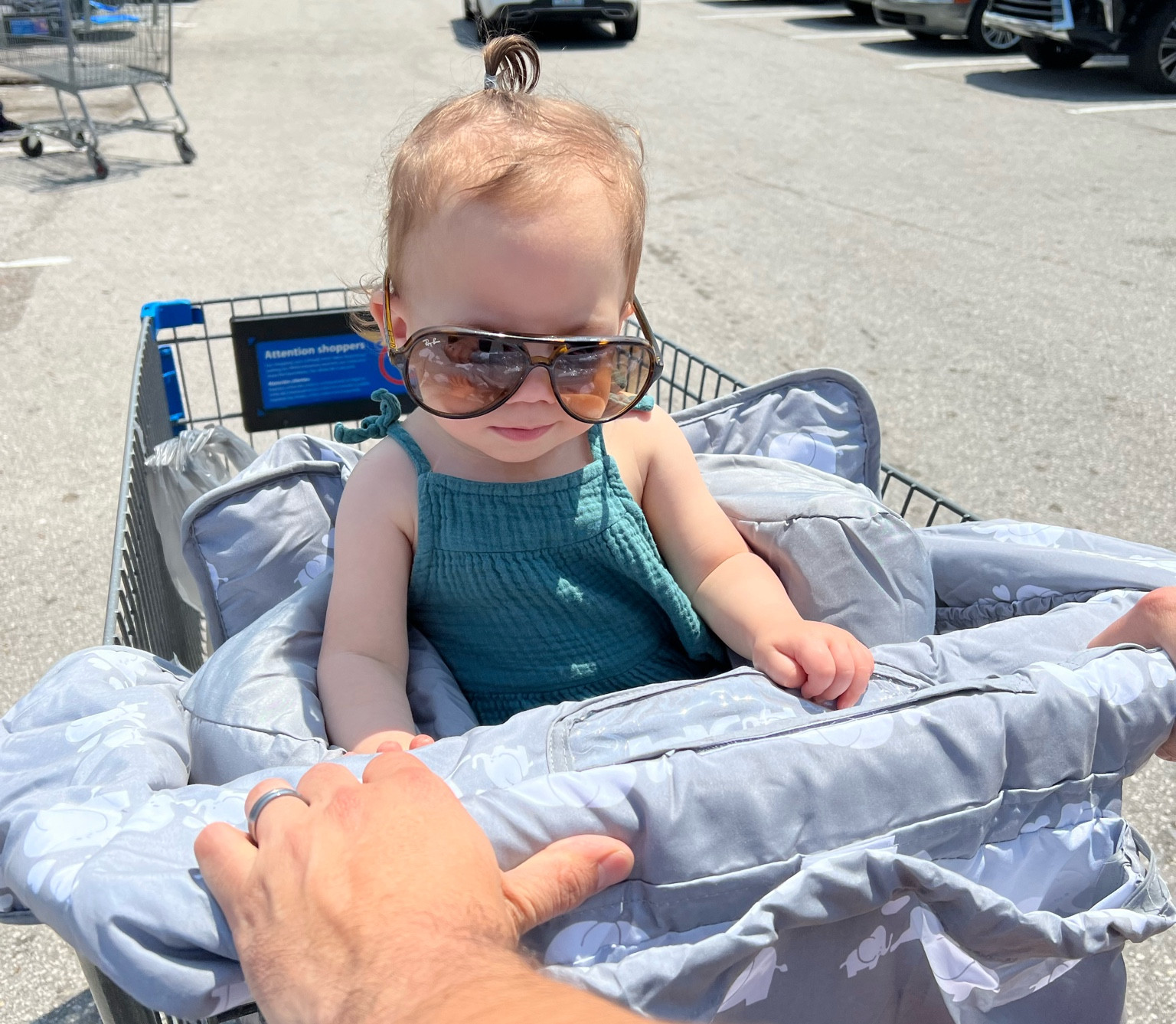 My 17 month old riding in style 💕 obsessed with this cart cover! It has a strap to hold her in, a strap to attach to the cart itself, a pillow for comfort behind her, a little bad / pouch for my stuff in front, a clear pouch in front of her to put my phone if she wants to watch something, a side pouch, AND it folds up into a bag for easy storage! 

#LTKkids #LTKbaby #LTKfamily