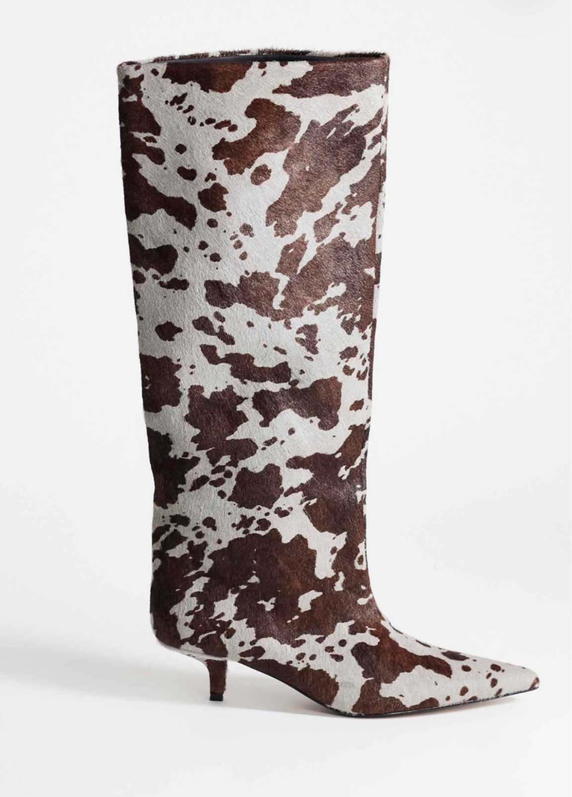 All sizes currently in stock. Don’t wait - these will sell out. Gray and brown cow print boot, wide calf friendly.
