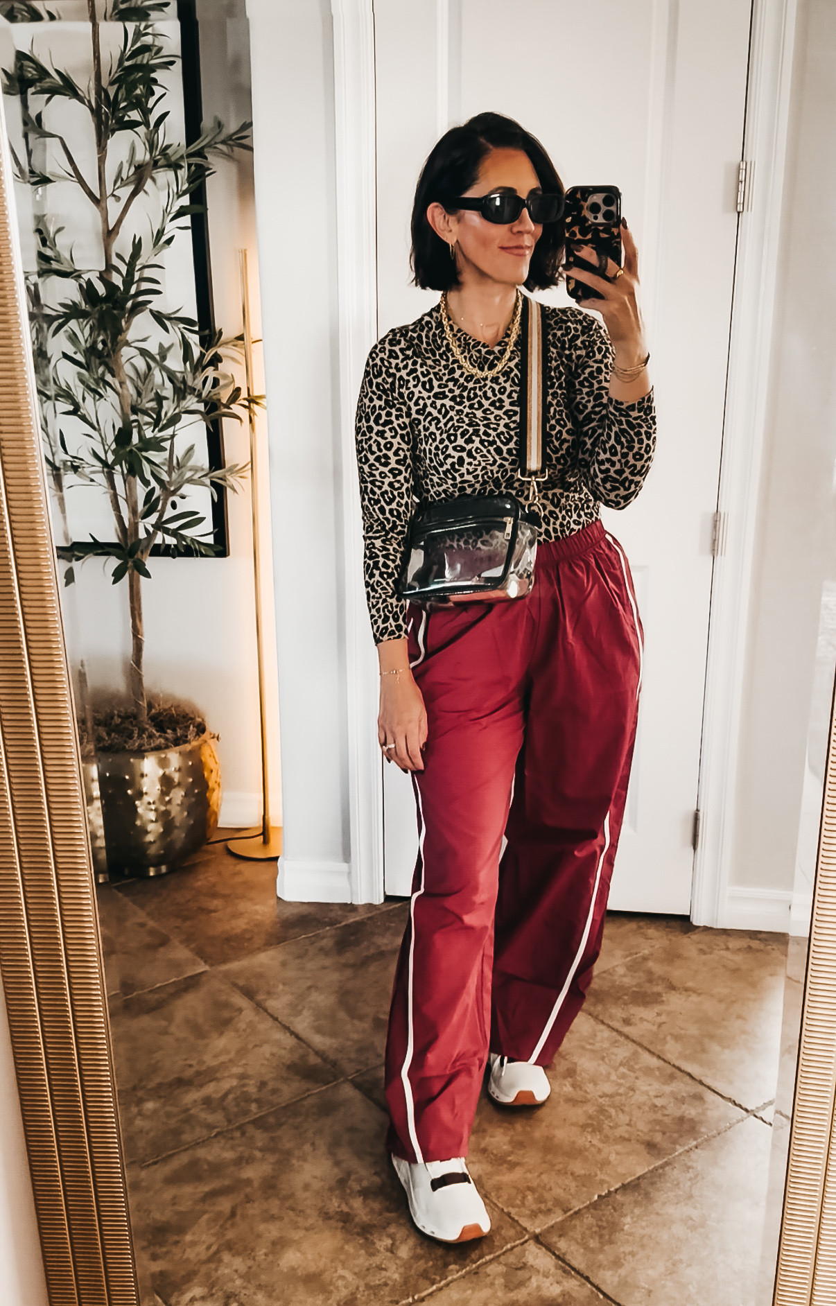 Sporty meets leopard and I’m here for it 🐆 These track pants are the perfect way to dress down a leopard top without losing any of the fun — comfy, elevated, and easy to throw on and go. 

• ribbed knit leopard tee - size, small • track pants - size small 

• Added a gold chain and my go-to crossbody to keep it from feeling too “athleisure.”

This combo is giving off-duty but still put together — exactly the vibe I’m chasing lately!! 

Walmart, Walmart, fashion, sports Mom outfit, fall outfit idea, Mom uniform, sideline style, what to wear to a game

#LTKootd #LTKOver40 #LTKActive