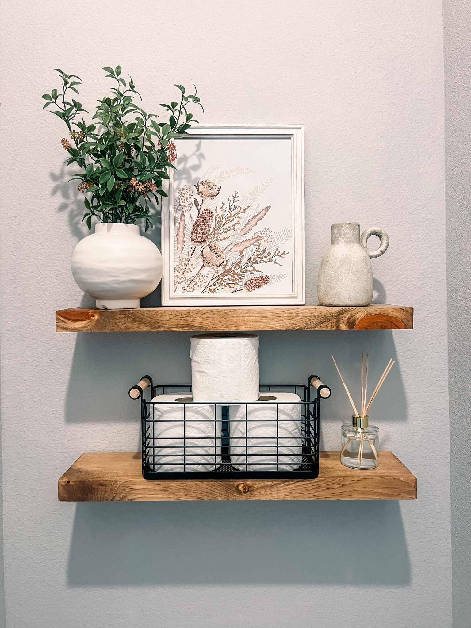 Bathroom shelf styling  The photo and little vase are from hobby lobby! 

#LTKunder50 #LTKhome
