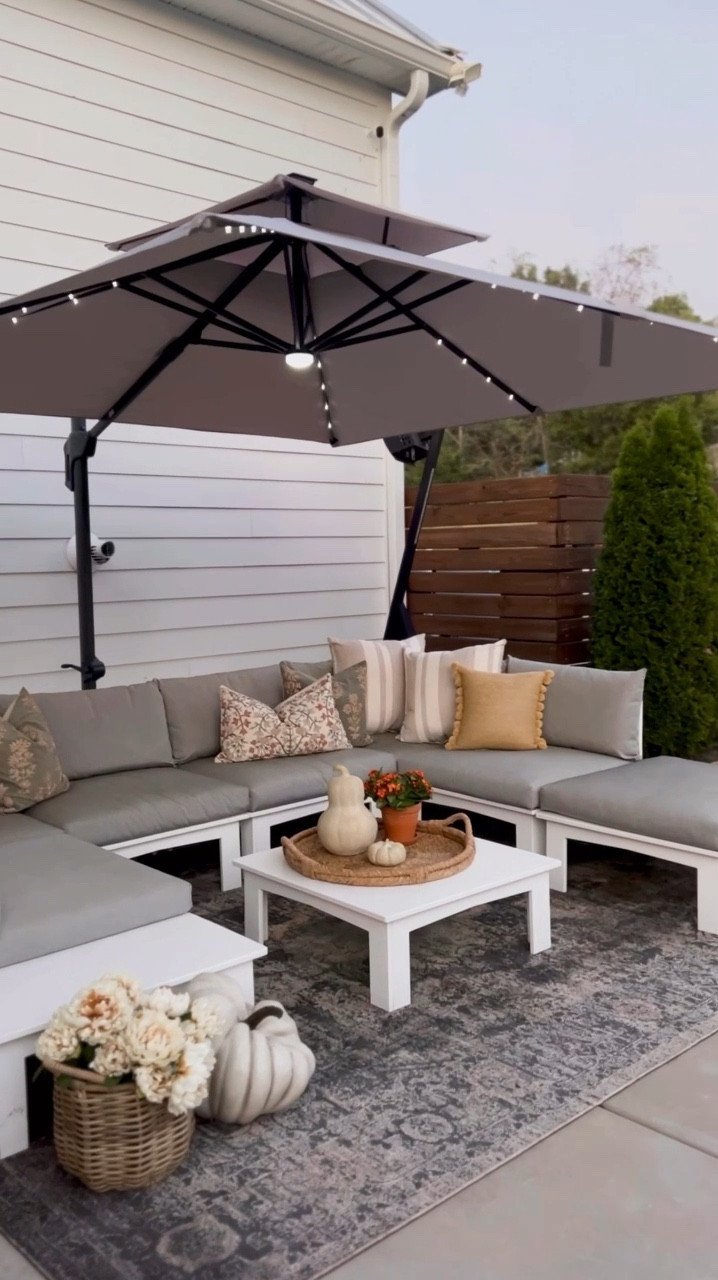 I found a cantilever umbrella that includes the base, has solar lights, and is actually affordable! 
 
We love this space on our patio but even with cooler temps finally coming in, it still gets hot in the sun! I decided it was time to fix that with the help of @bcproducts! They have a super affordable cantilever umbrella that actually includes the base!  It's crazy but a lot of them don't! This umbrella also has solar lights for evenings, and I love the additional light and ambiance it provides! It comes in a ton of colors, and we have it in Fog Gray!

#LTKVideo #LTKStyleTip #LTKHome