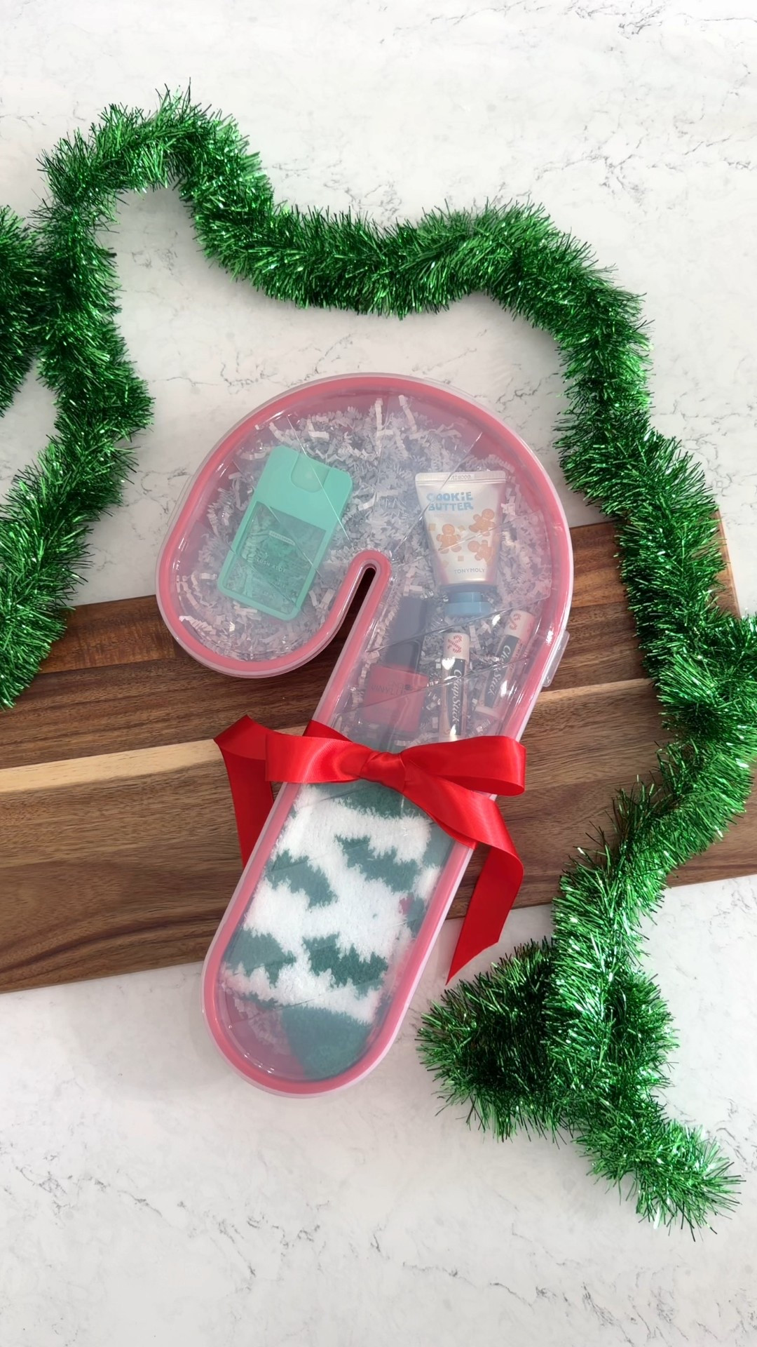 Such a fun gift using the viral $10 Candy Cane Box! 🎅🏼❤️

This is so great for a gift exchange gift, teacher gift, or friend Christmas gift!

🎁 COMMENT “shop” for all the links.

I packed it with cozy socks, candy cane chapstick, nail polish, cookie butter lotion and a spray hand sanitizer.🎄

#christmasgiftideas #christmasdiy #holidaygifts #targetfinds #targetholiday

#LTKGiftGuide #LTKFindsUnder50 #LTKHoliday