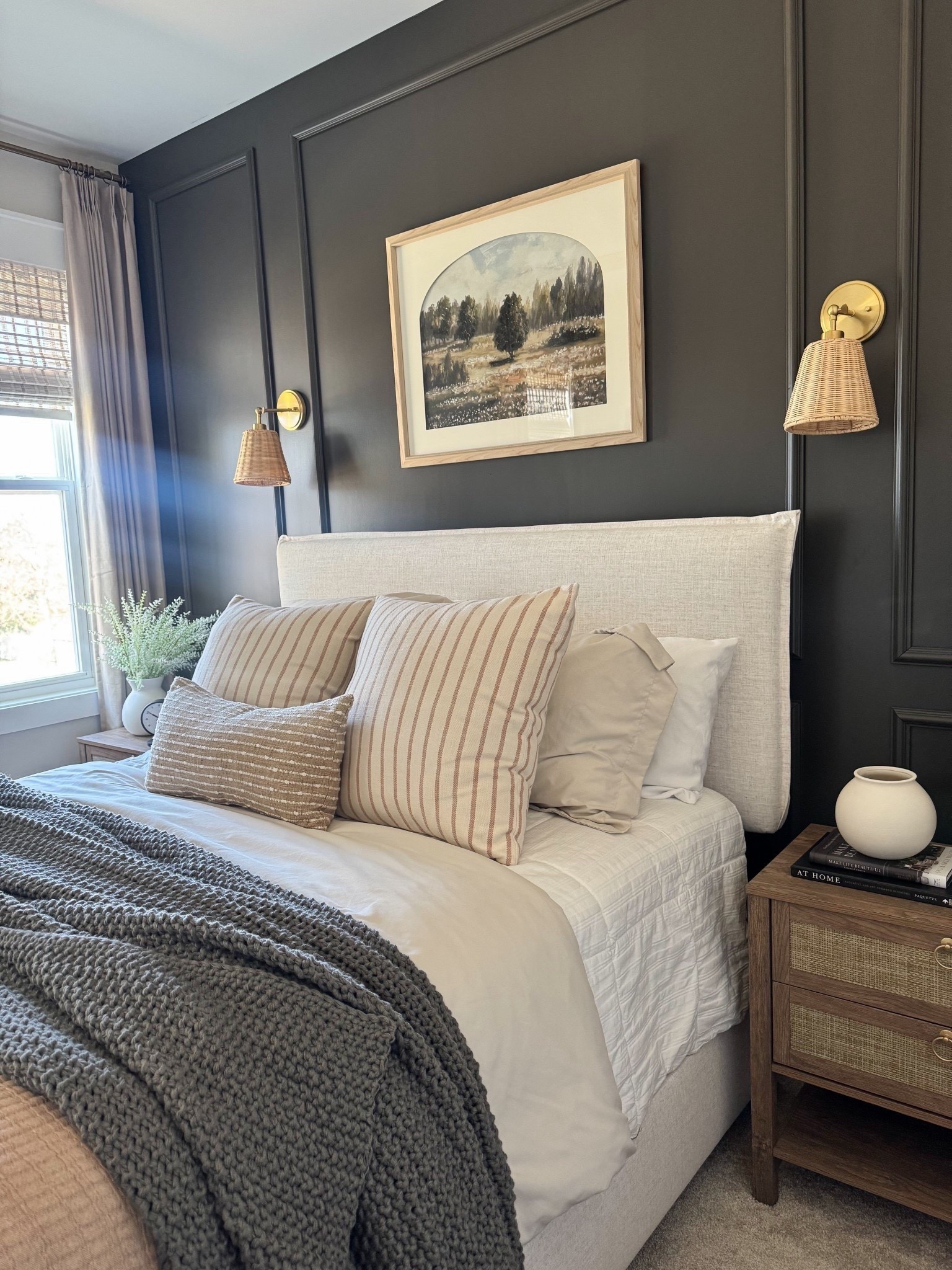 Guestbedroom, moody accent wall, upholstered bed, moody dark wall, bedroom design, bamboo shades, wall sconces, art above bed, guest bedroom ideas 



#LTKHome #LTKHome